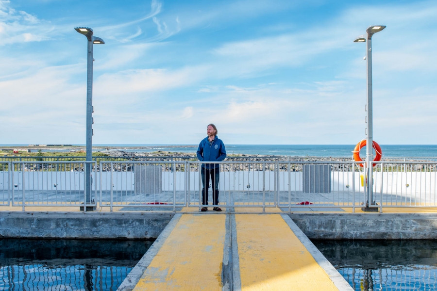 A man stands on a dock 