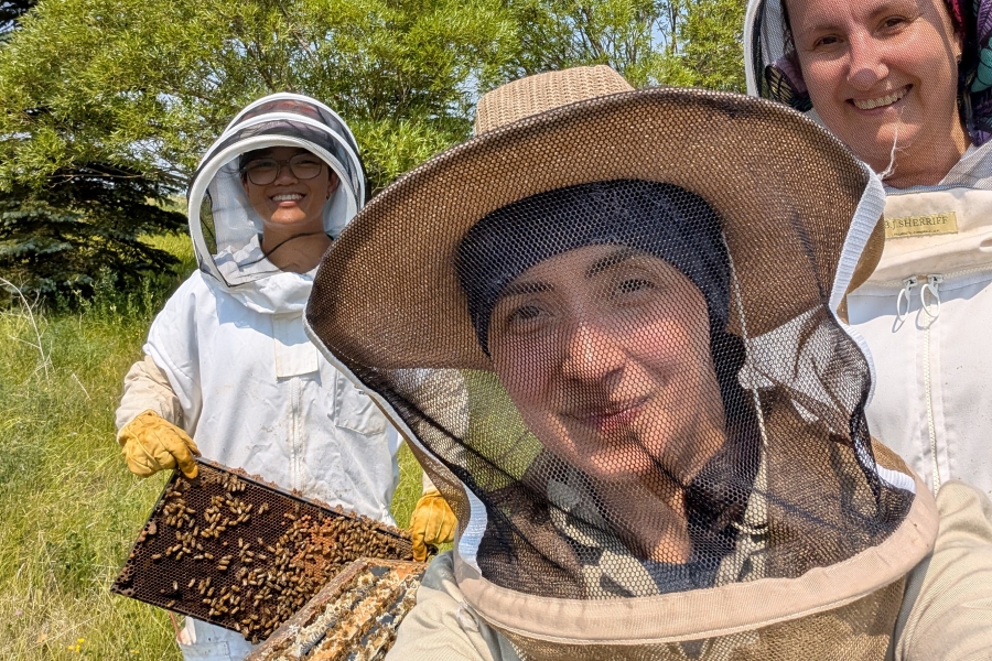 Nuria Morfin in bee keeper clothing
