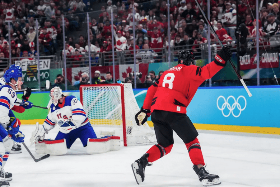 A Team Canada hockey player celebrates scoring a goal against the United States during the second period of the Men’s Gold Medal match at the Milano Cortina 2026 Olympic Winter Games in Italy. 