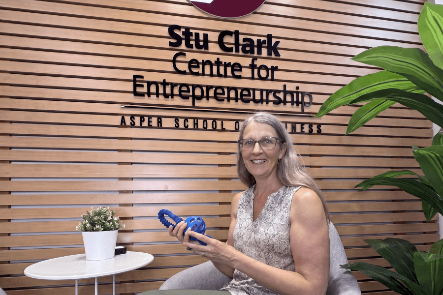 Selena Randall at the Stu Clark Centre for Entrepreneurship, showcasing one of the interactive tools she uses in her online dog behavior consulting.