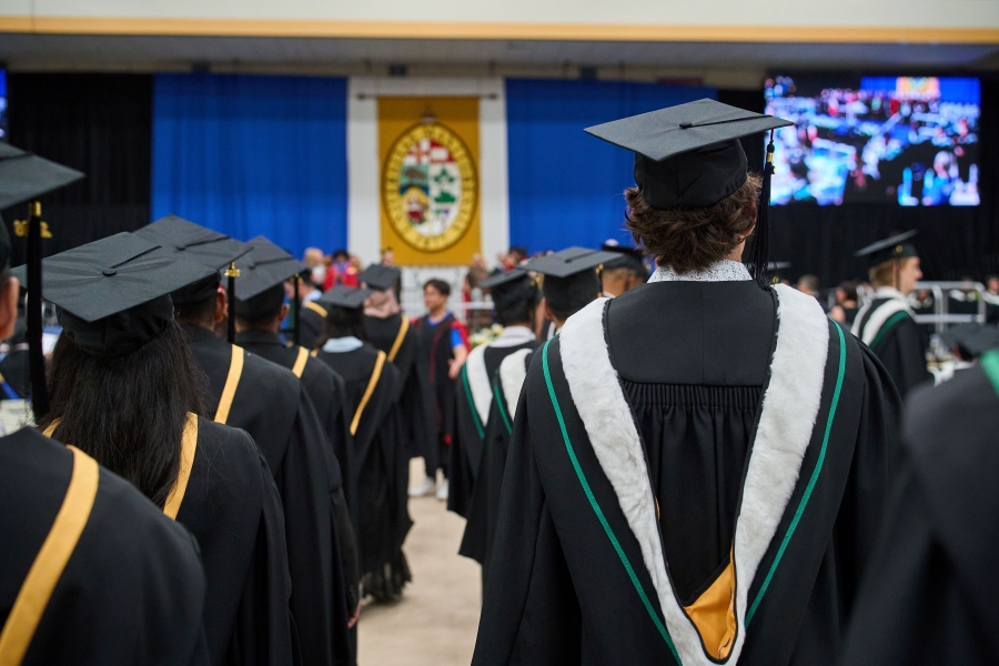 UM grads file into their ceremony