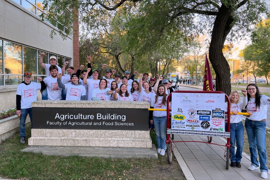 Students participating in Bedpush 2025 posing in front of the Agriculture Building.