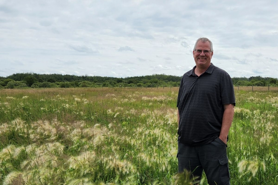 Bruno Dyck stands at Long Way Homestead