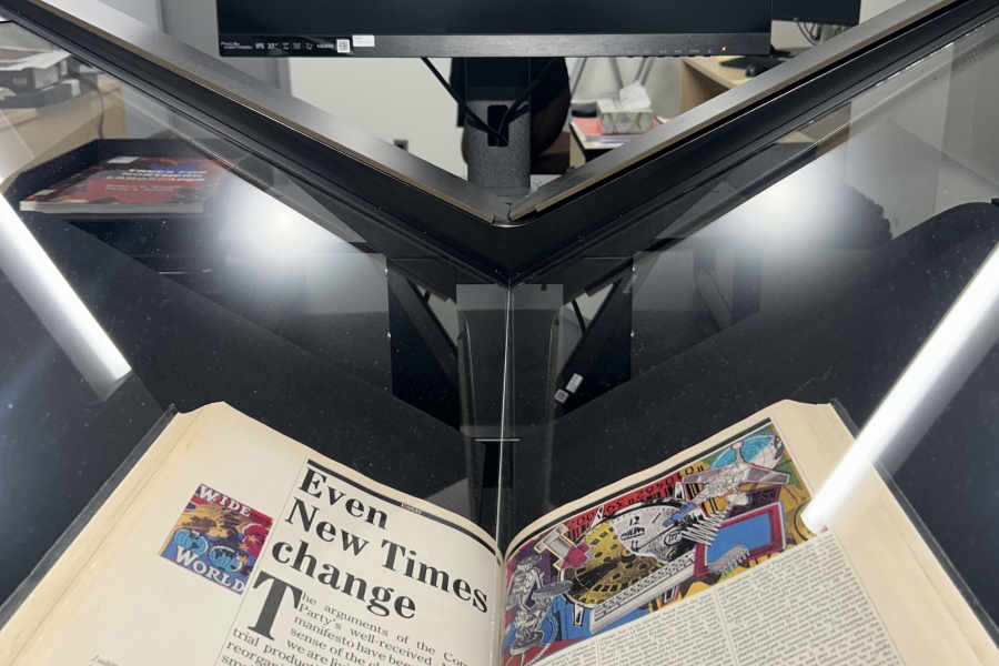 A large format scanner with archival book on it