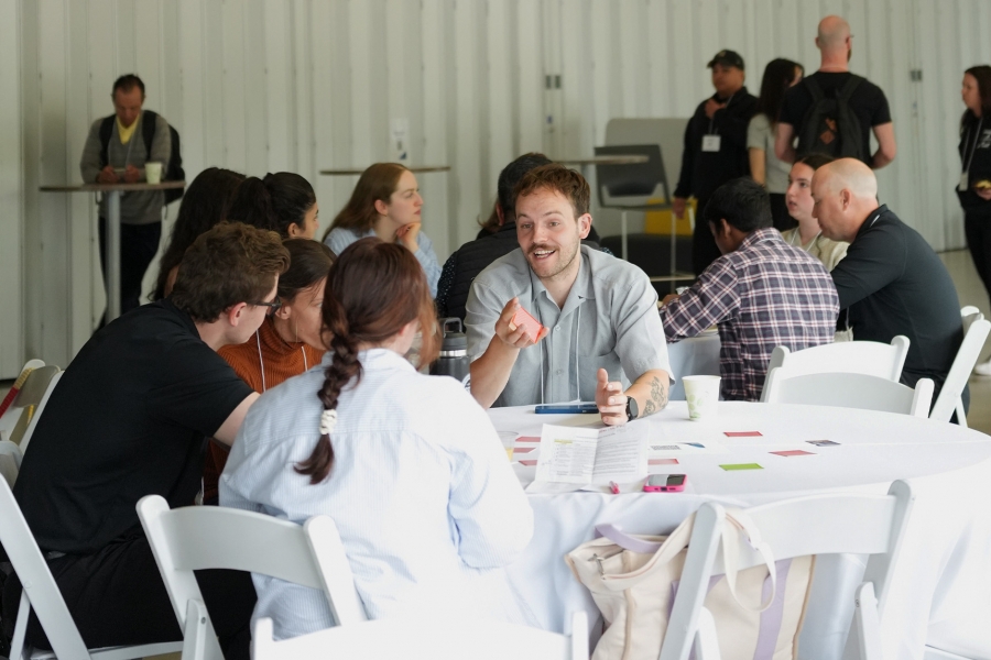 A group of students sitting at a table chatting
