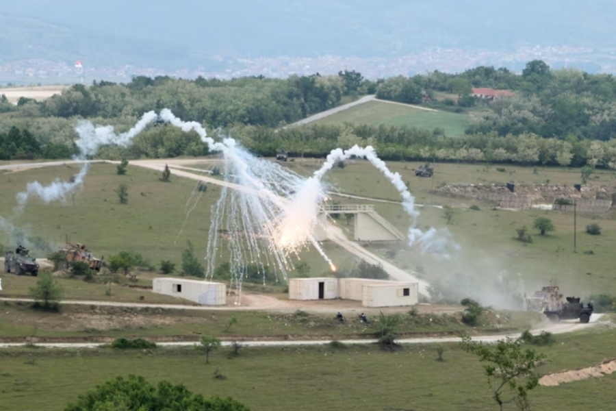 military explosion on a field