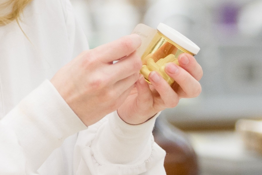 Patient holding a prescription bottle.