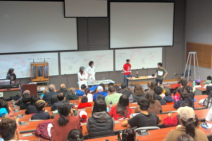 A wide shot of the attendees of the Physics show.