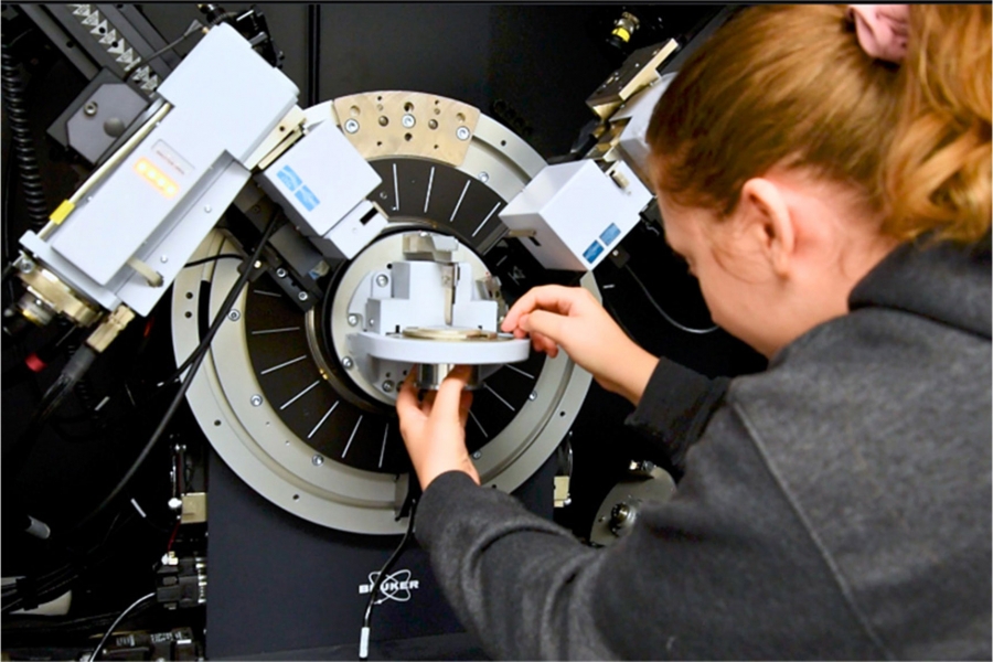 Physics student with the bruker d8 discover x-ray diffractometer.