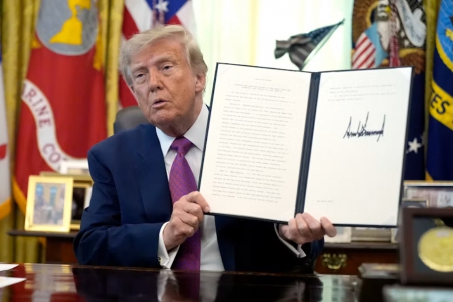 Trump holding a document