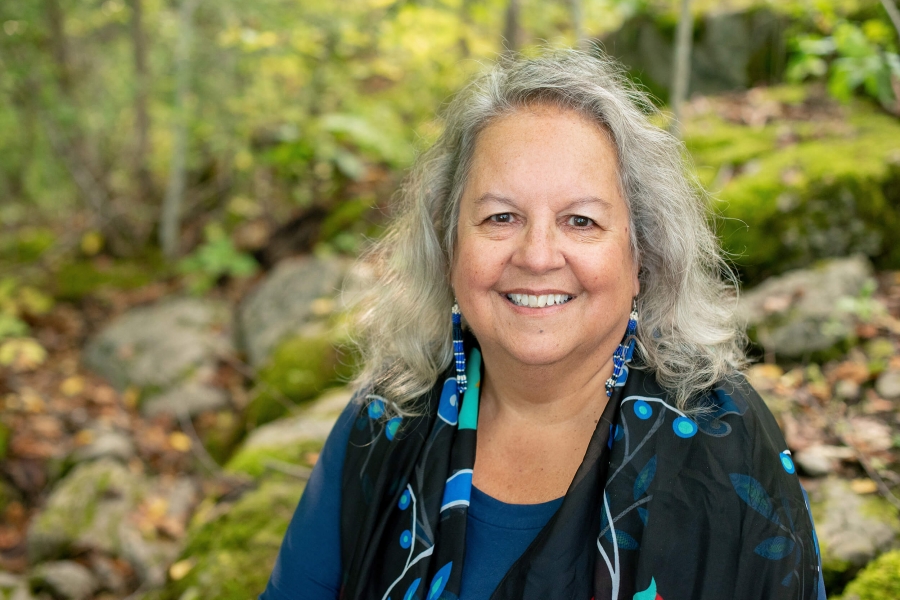 Dr. Robin Wall Kimmerer in the forest