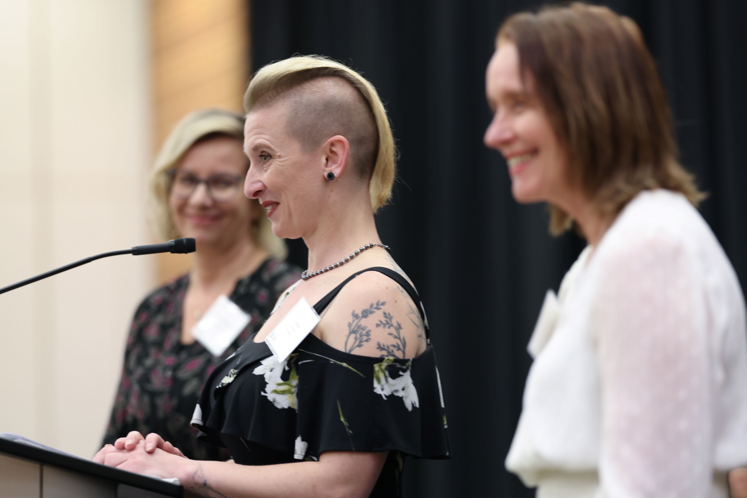 A student is giving a speech on stage.