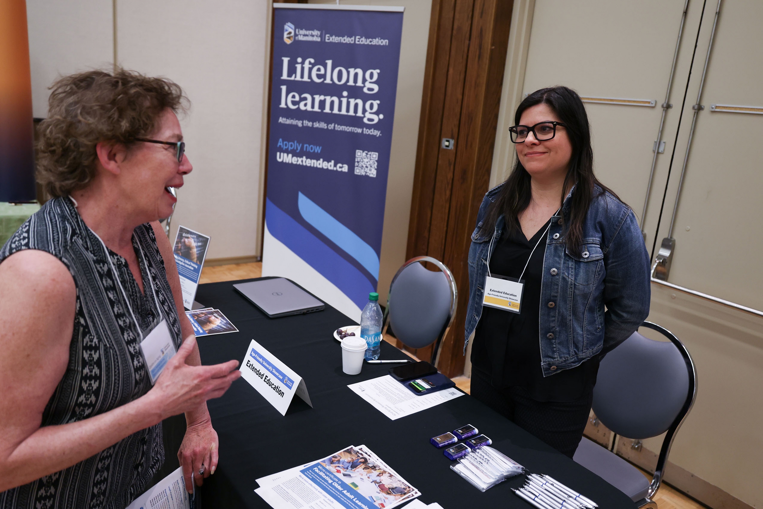 people talking at the Age-Friendly University Showcase