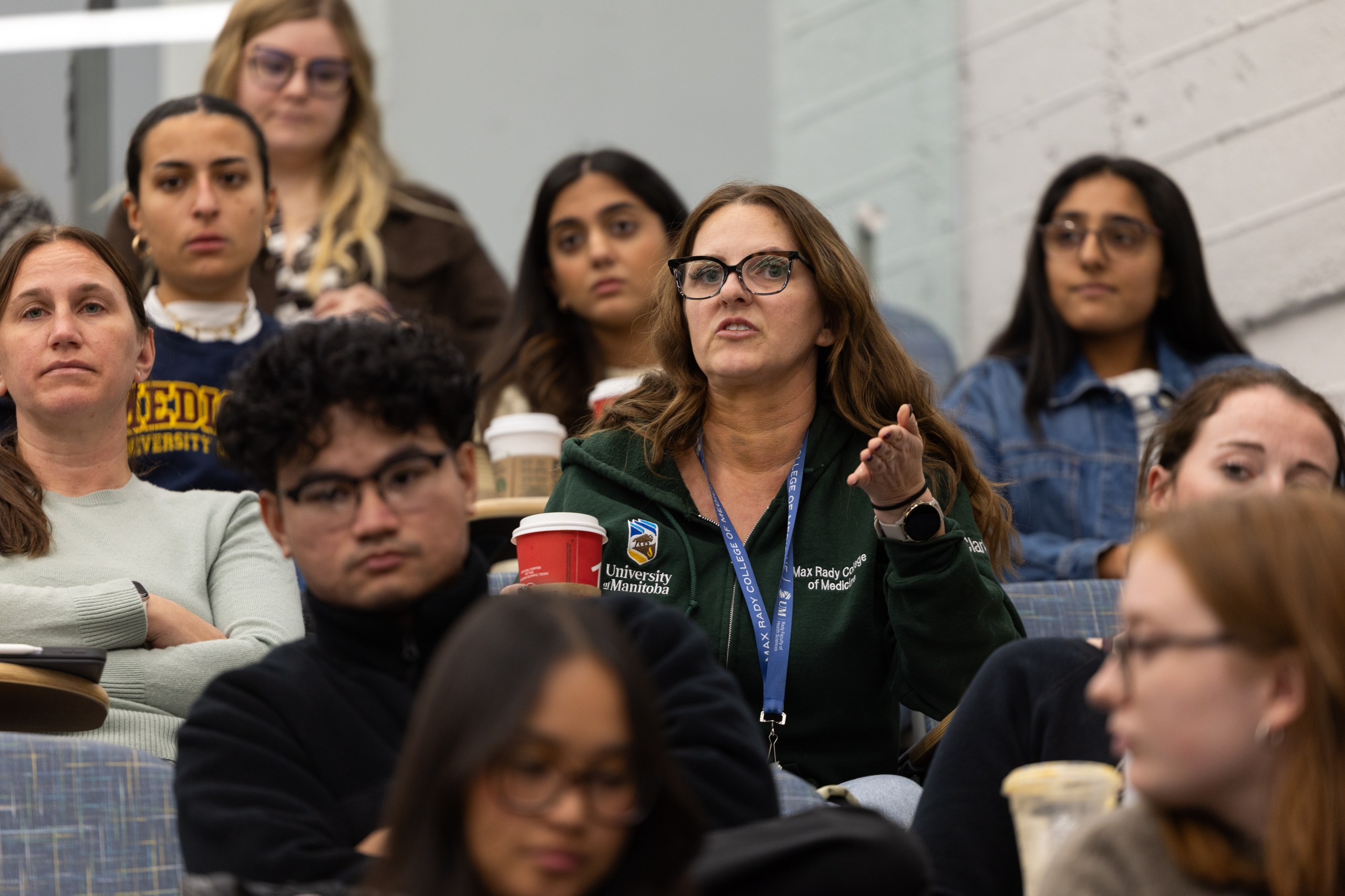 Medicine student Tara Clarke asks a question during the panel discussion.