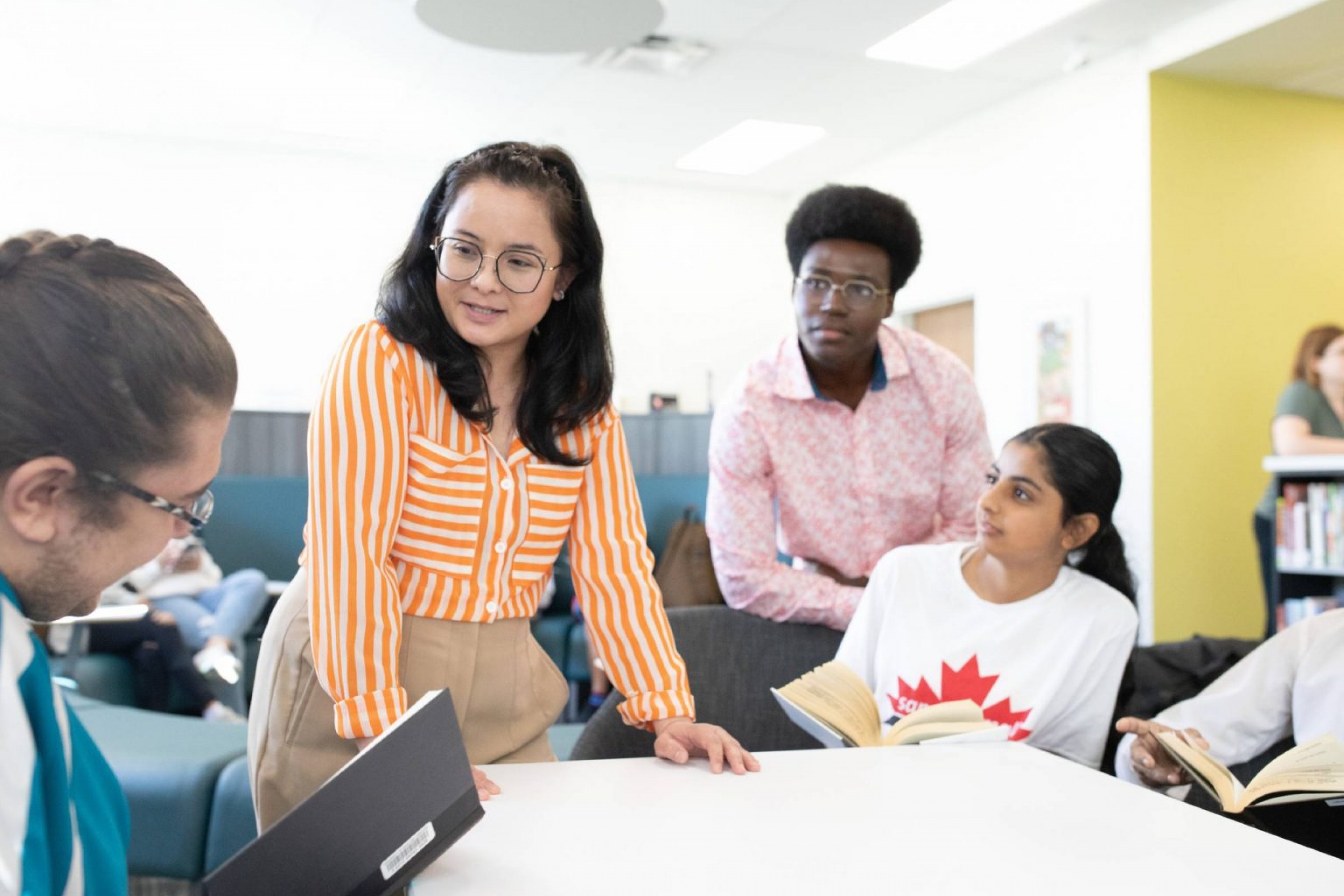 Teacher interacts with multicultural student group