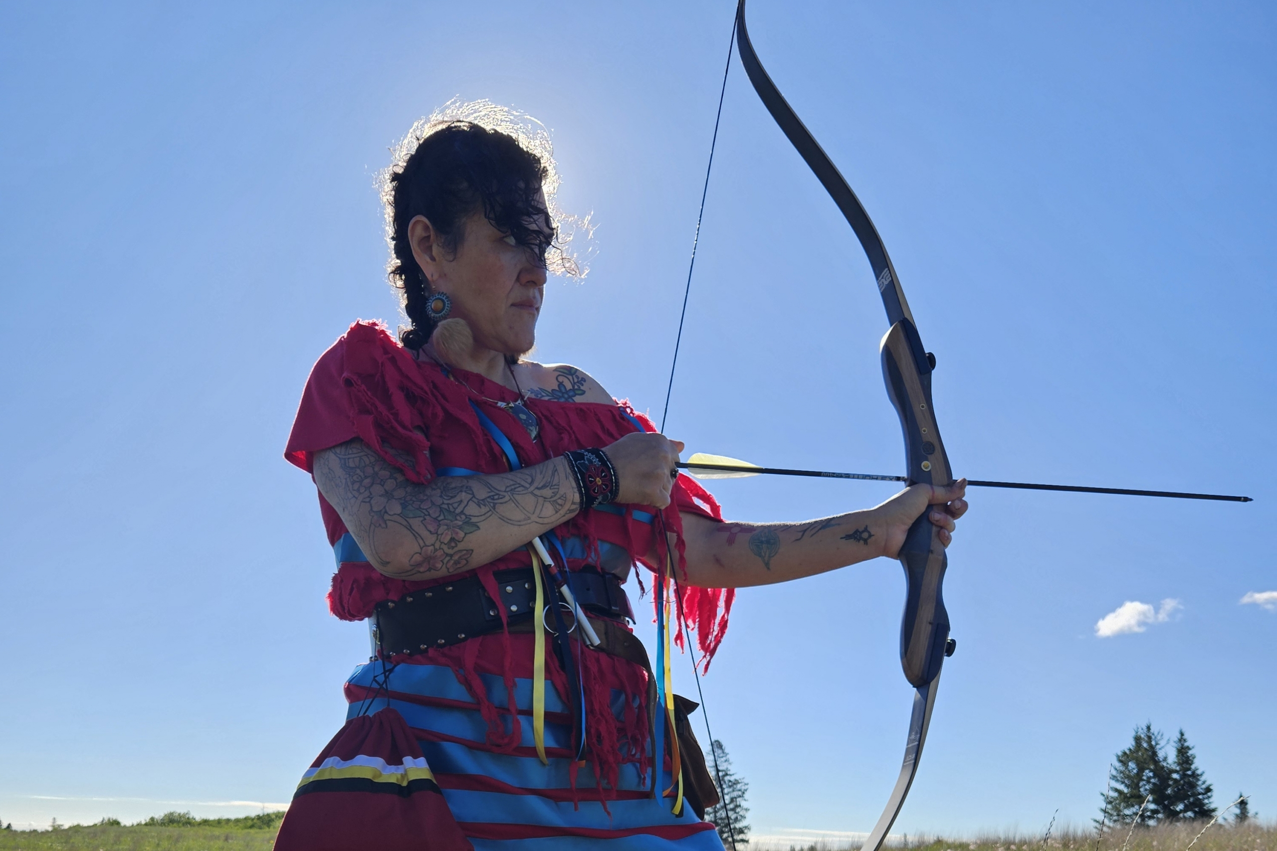 Art piece, photo of Aimee with bow and arrow