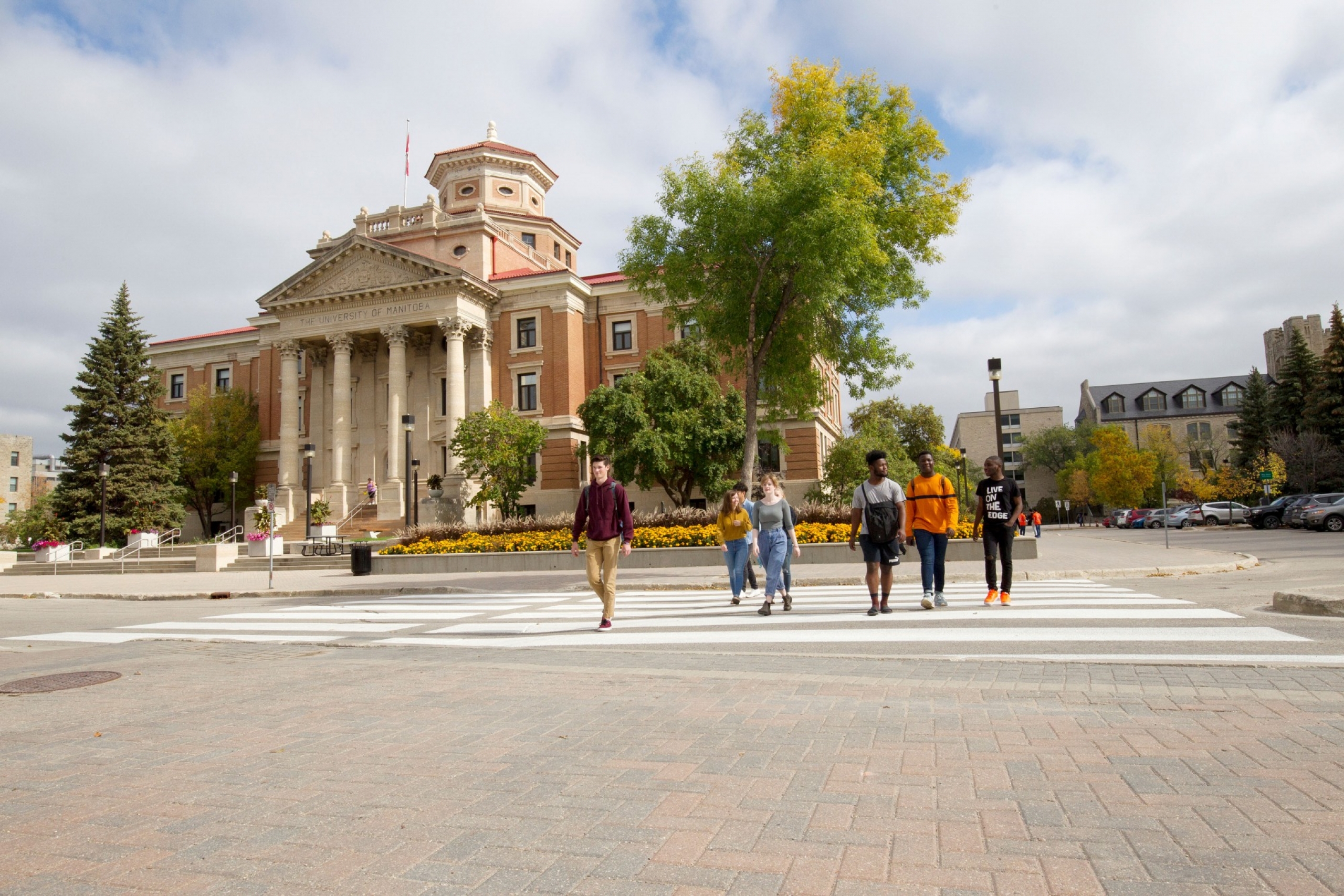 Students walk through buildings on campus