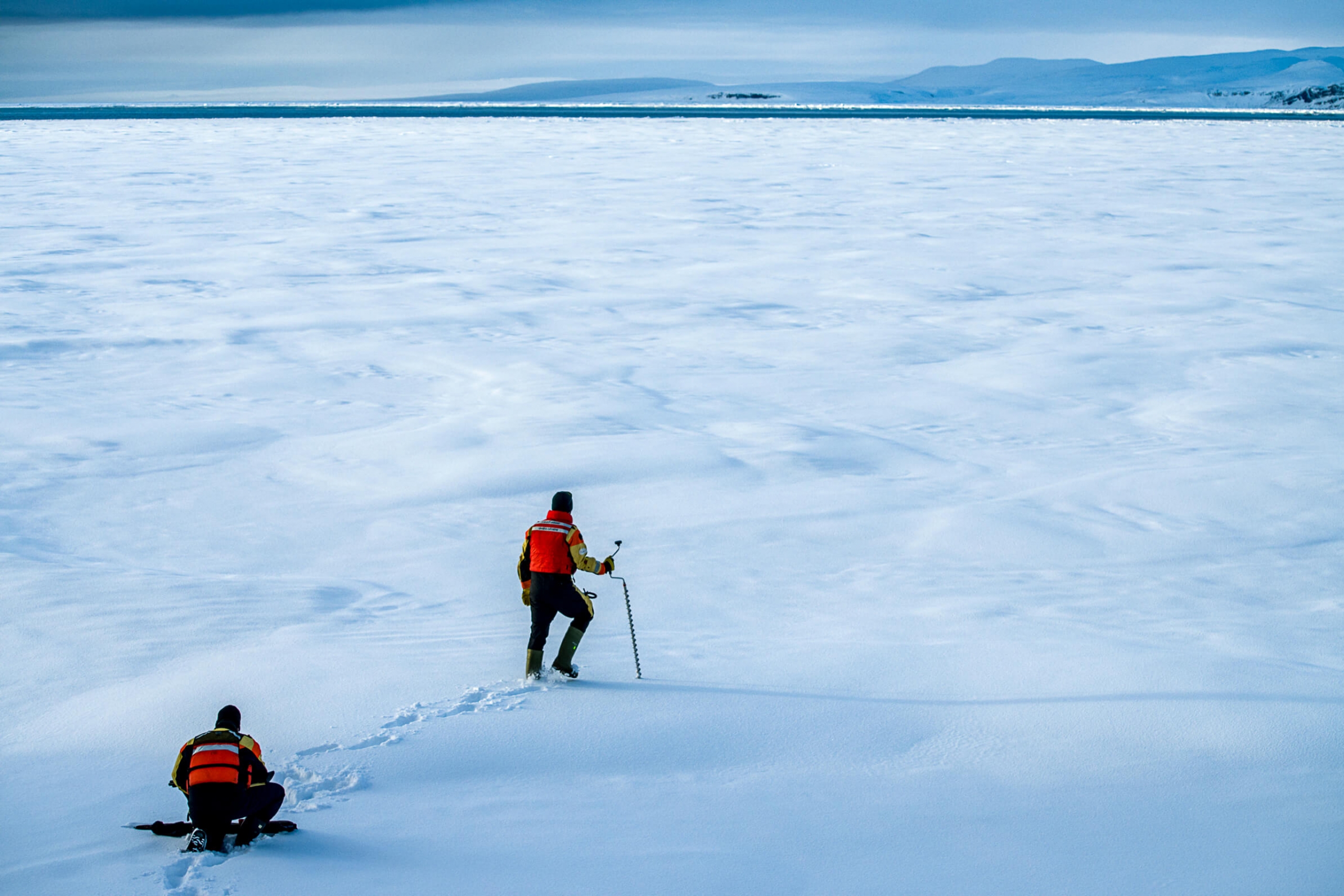 A researcher walks on the ice