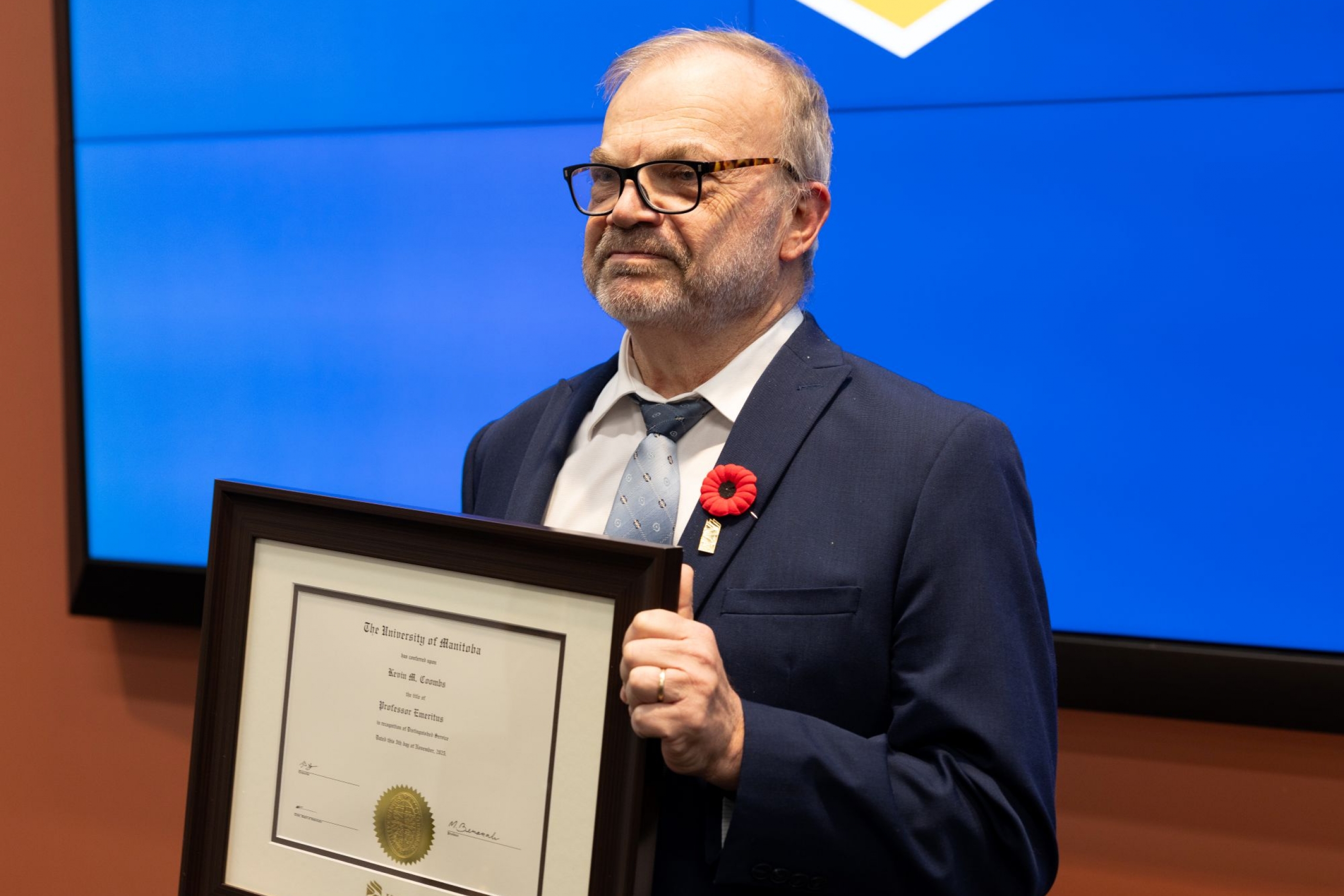Kevin Coombs with certificate