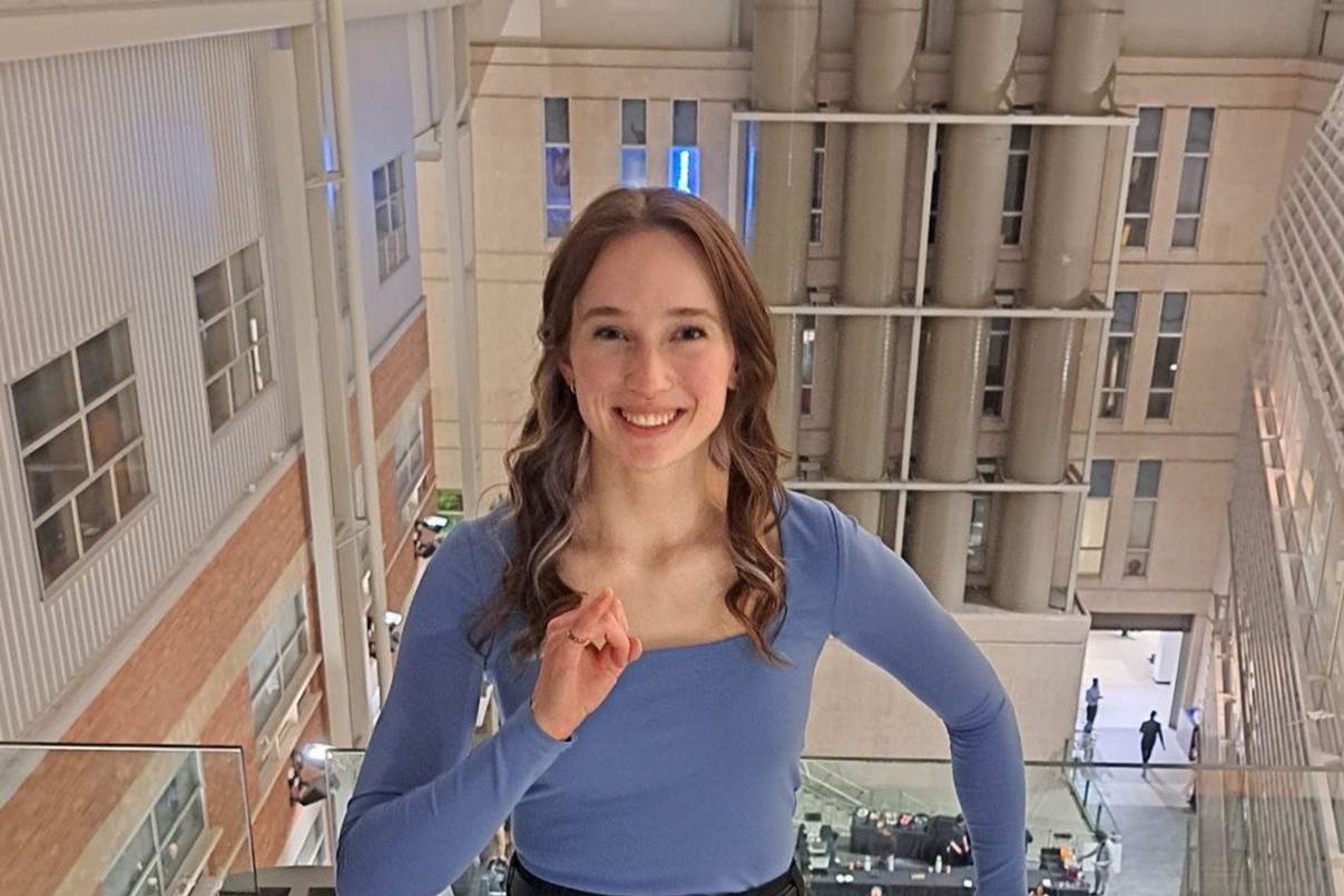 A person posing with iron ring on pinky finger