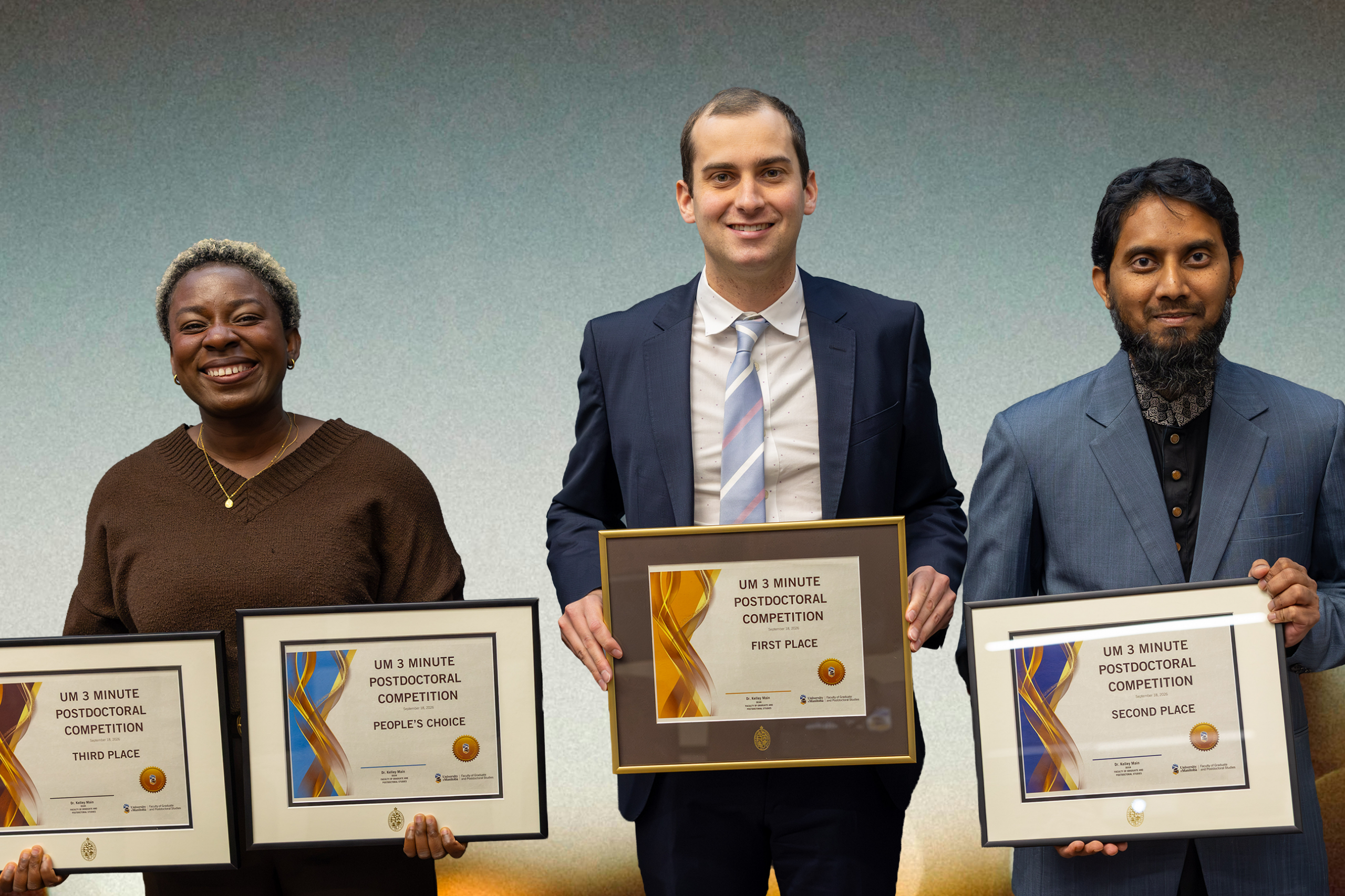 Award winners holding their certificates