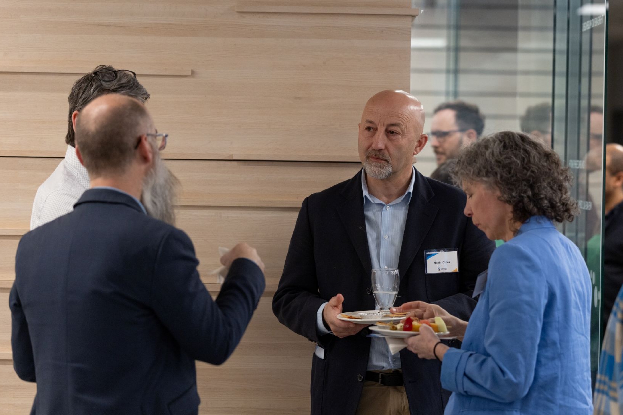 four people visiting at reception