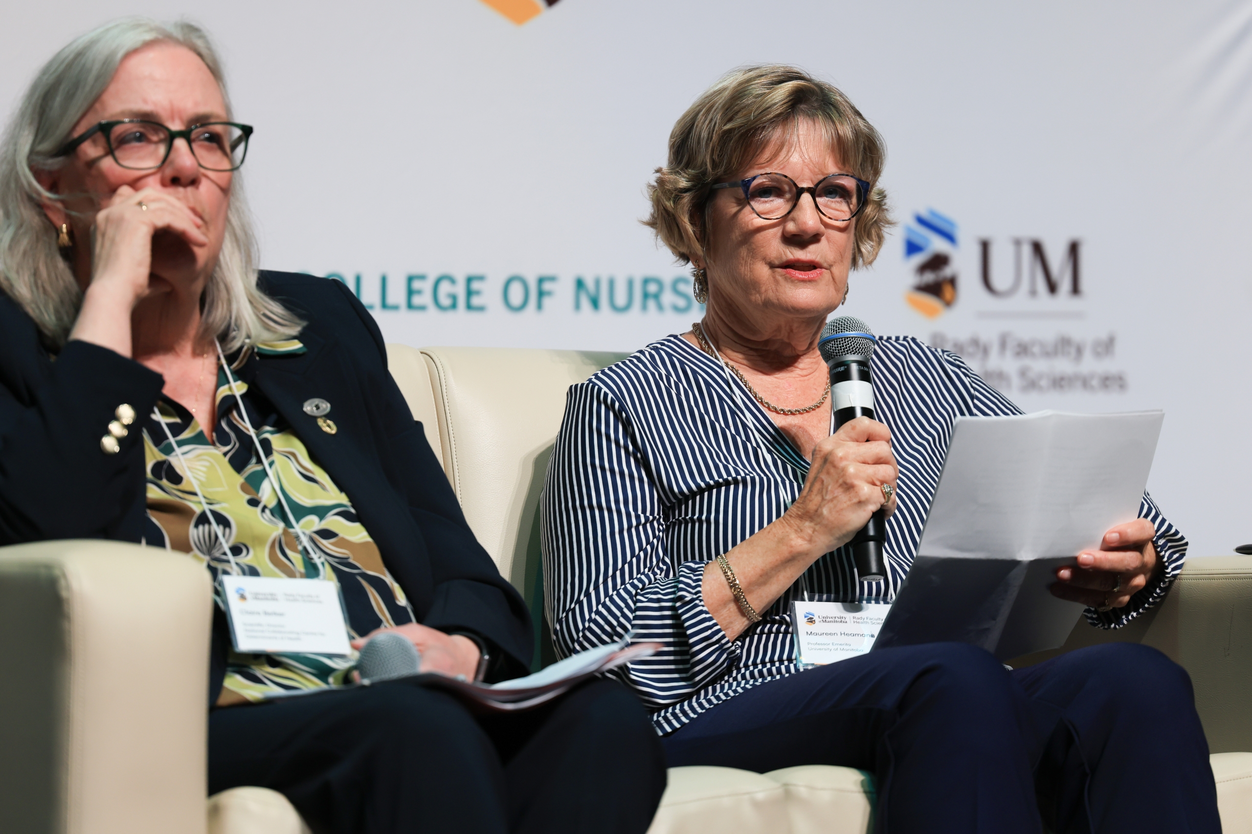 Dr. Maureen Heaman sits in a chair and speaks into a microphone. 