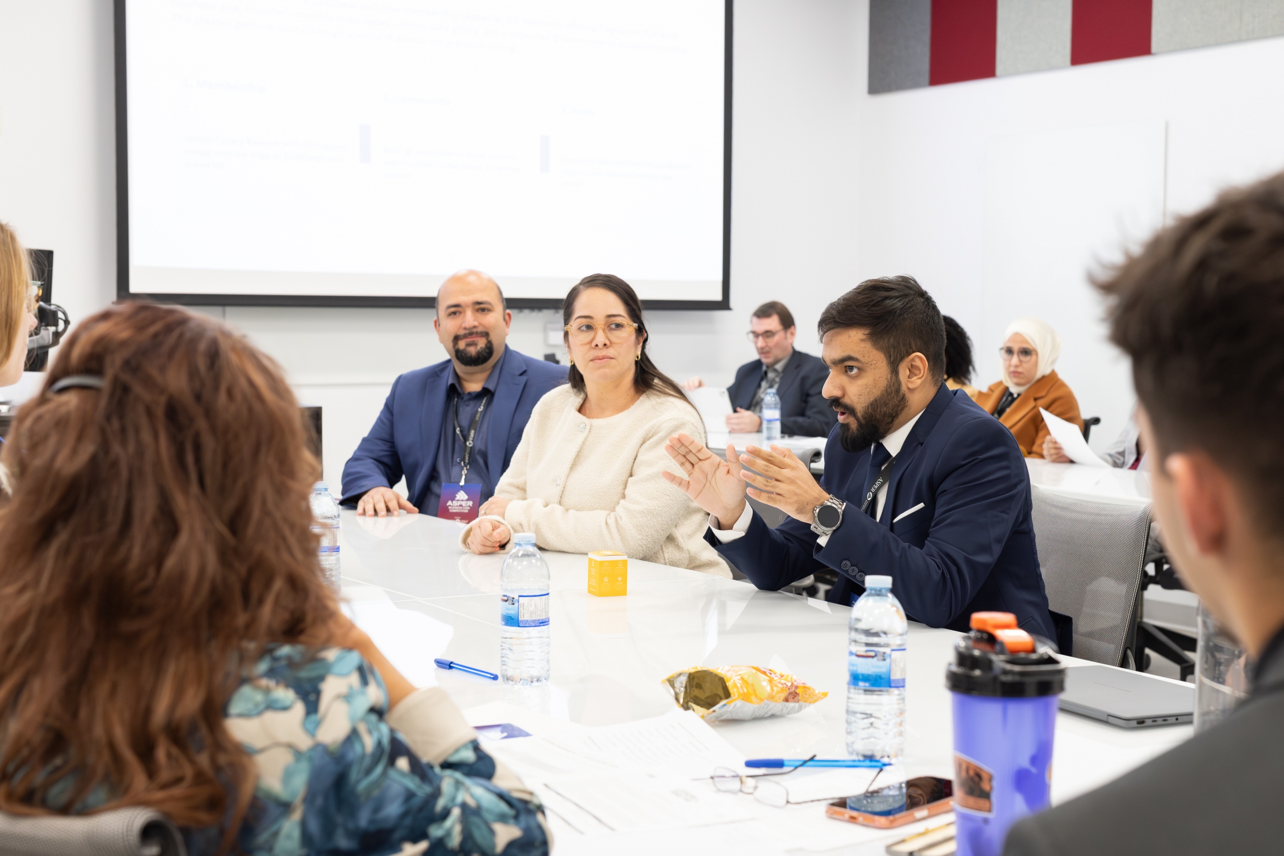 A competitor speaks in a boardroom