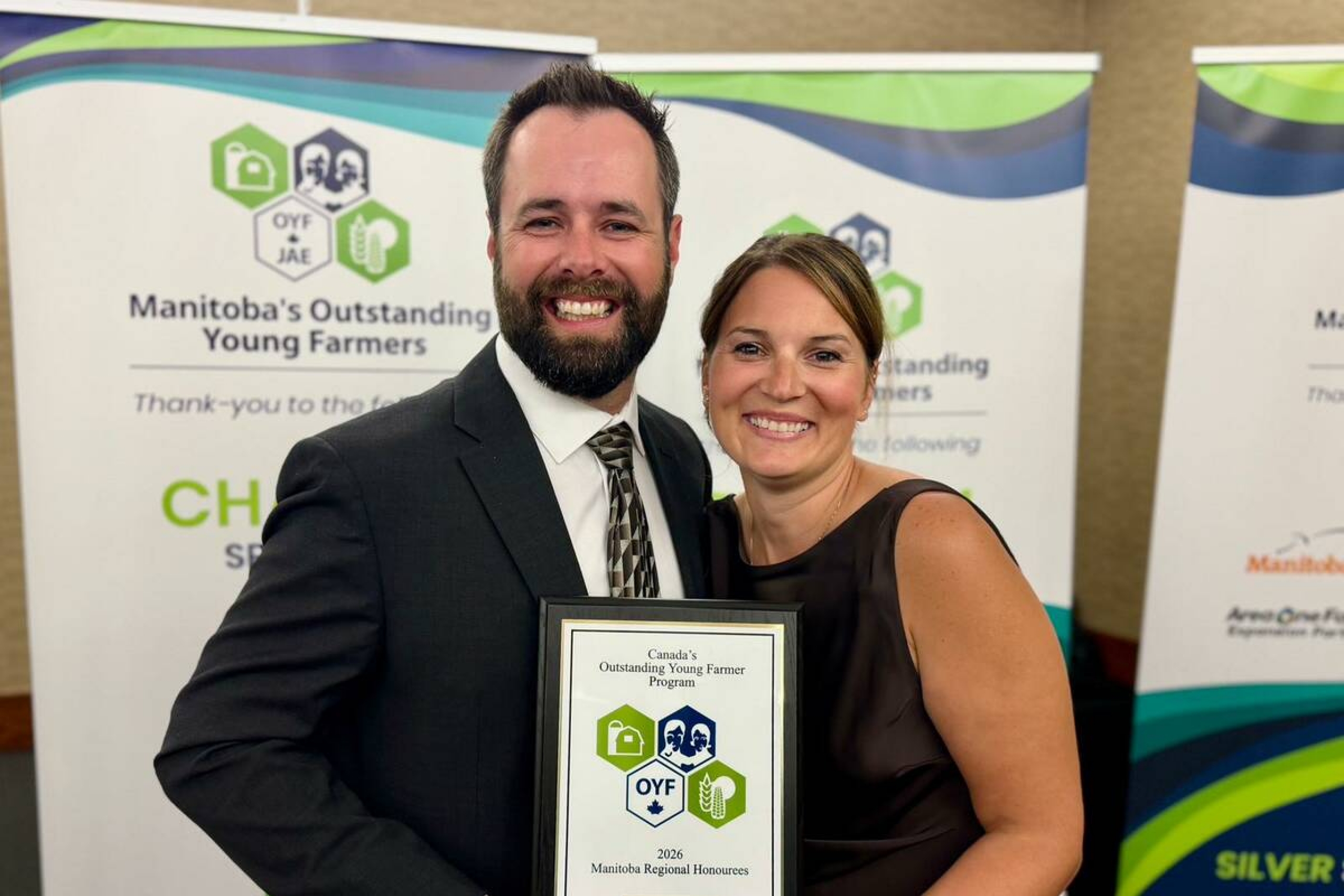 A couple smiling at camera