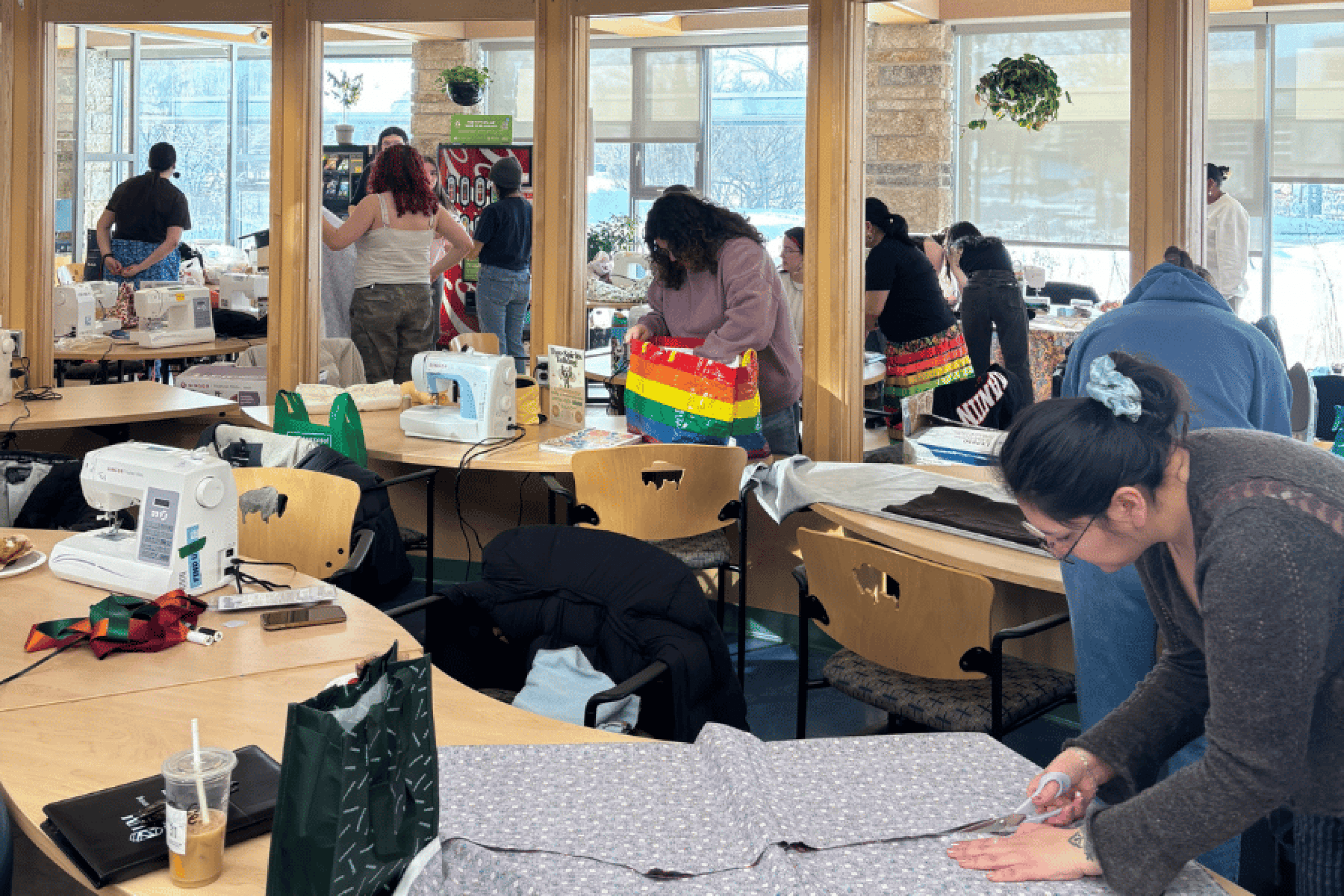 Participants sew and create crafts together during a Two-Spirit community workshop.
