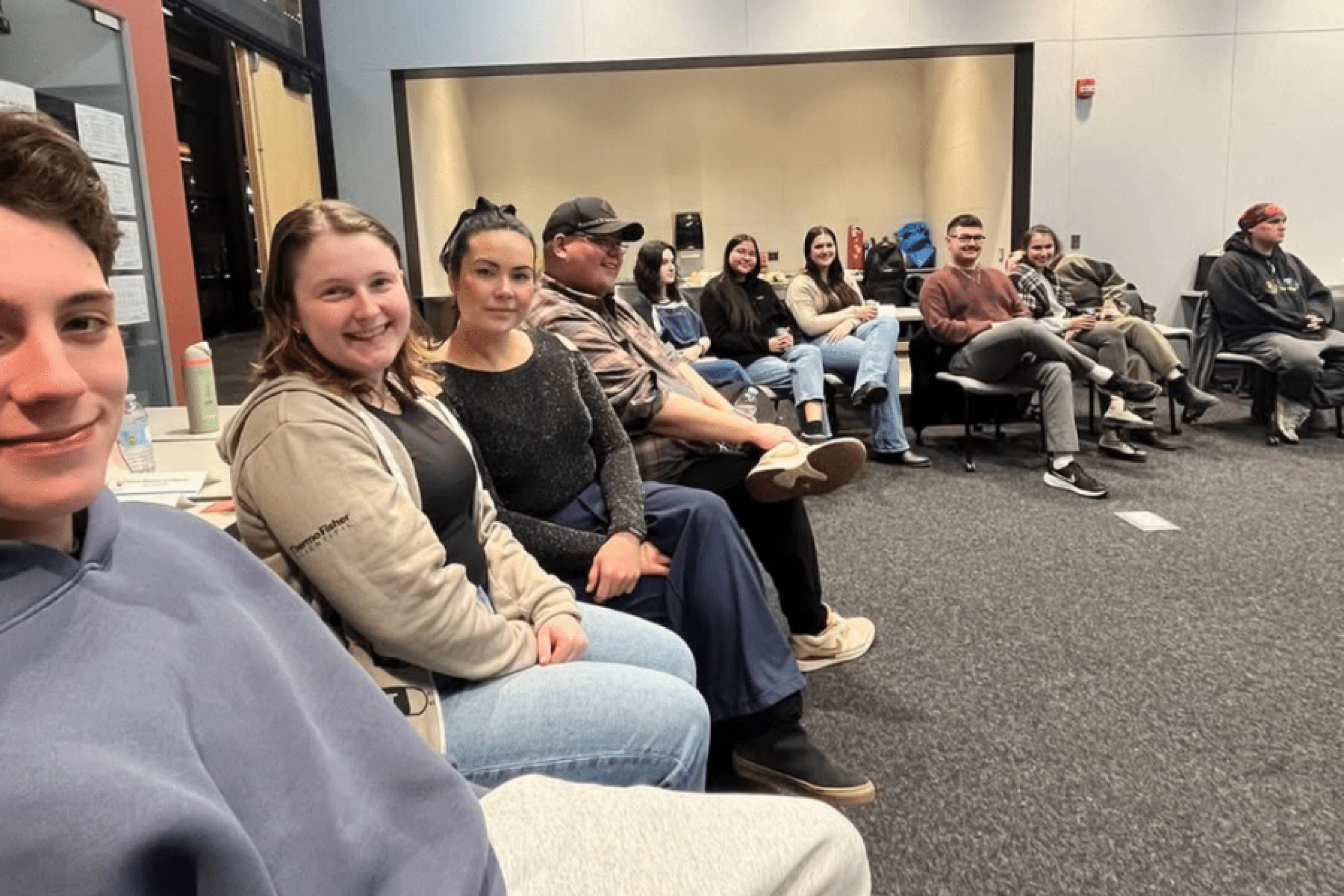 Students sitting in a circle during a group discussion session.