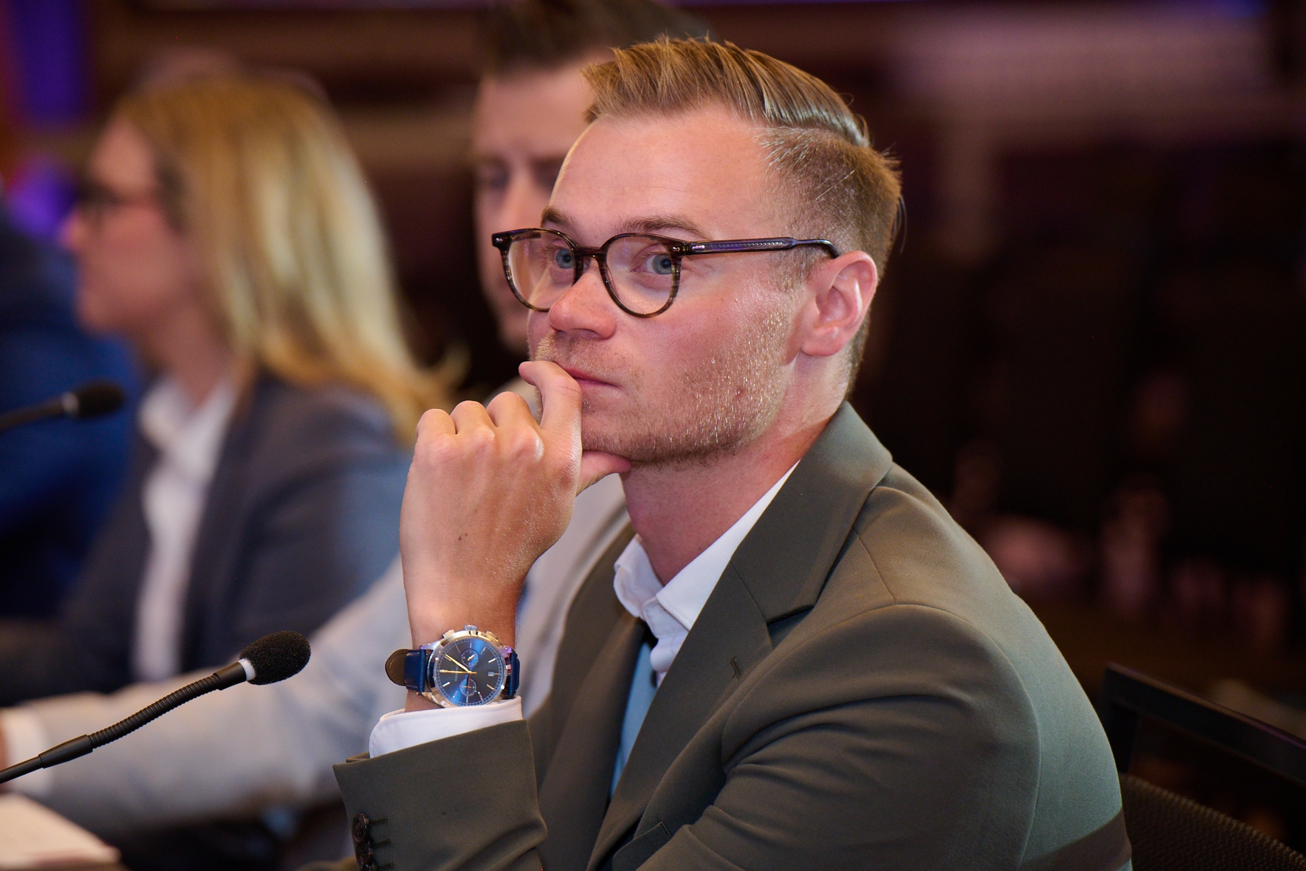 Josh Zaporzan sits at a judges table