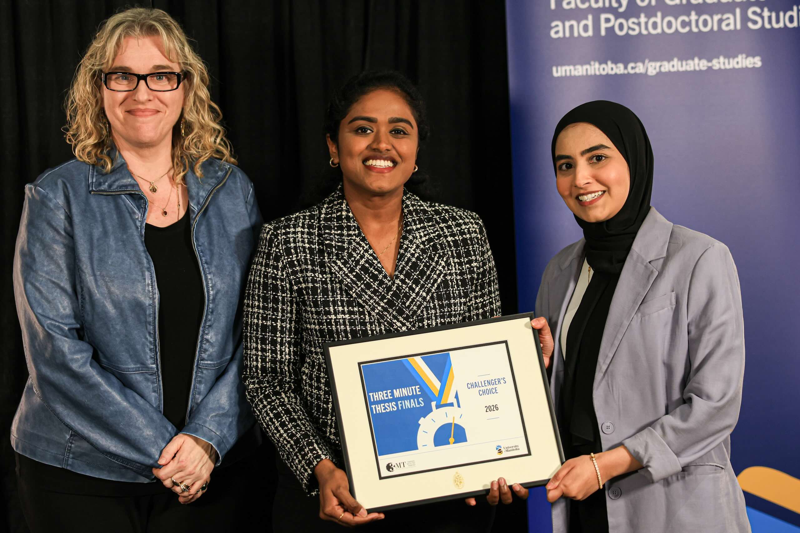 Two people receiving an award.