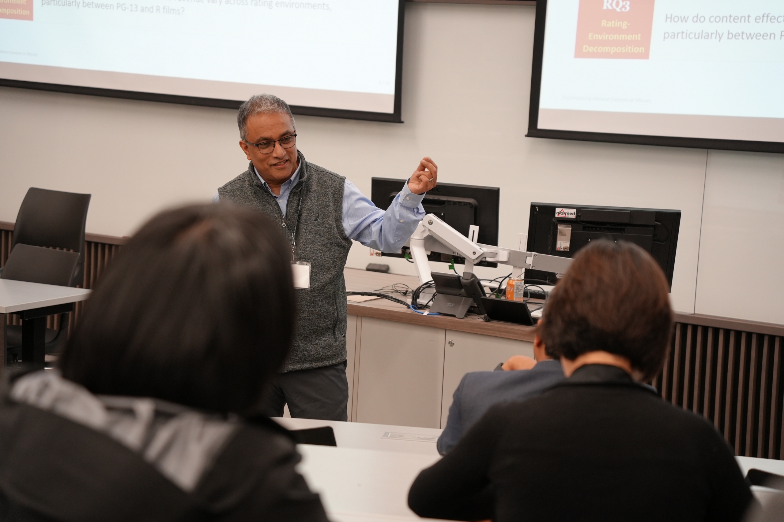An academic presents in a classroom