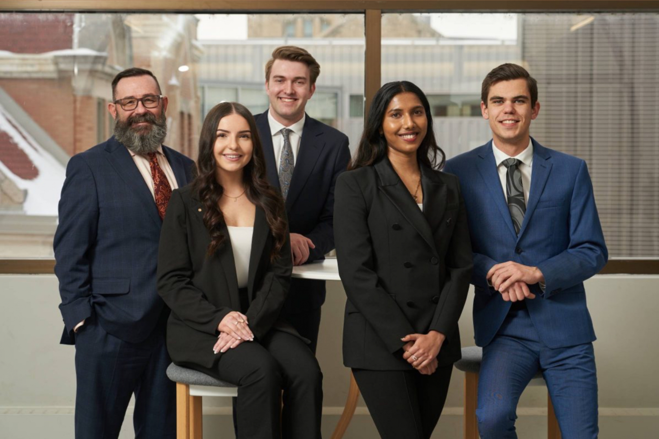 Taylor Bially with a case competition group