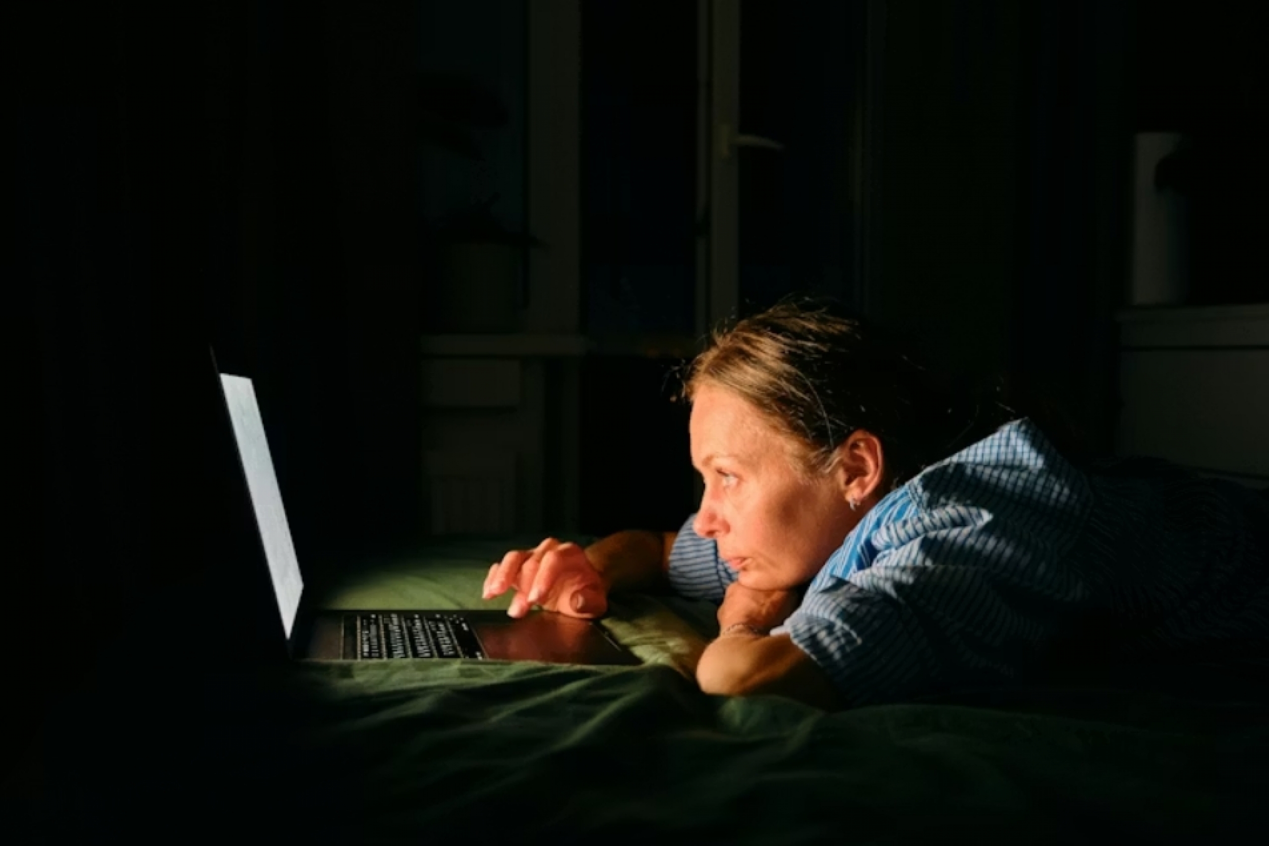 Woman looking at laptop