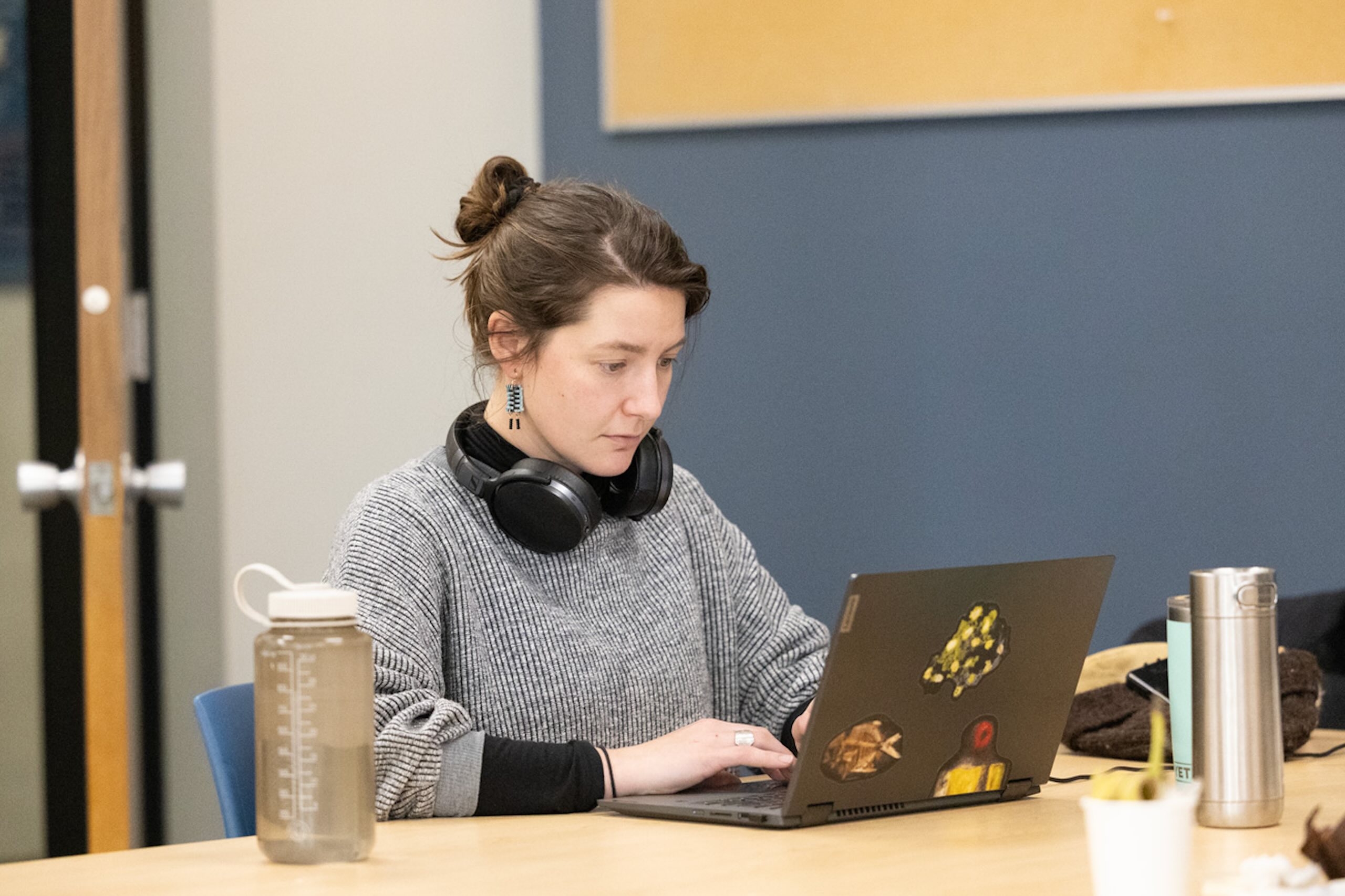 Graduate Sutdent working on thesis in retreat