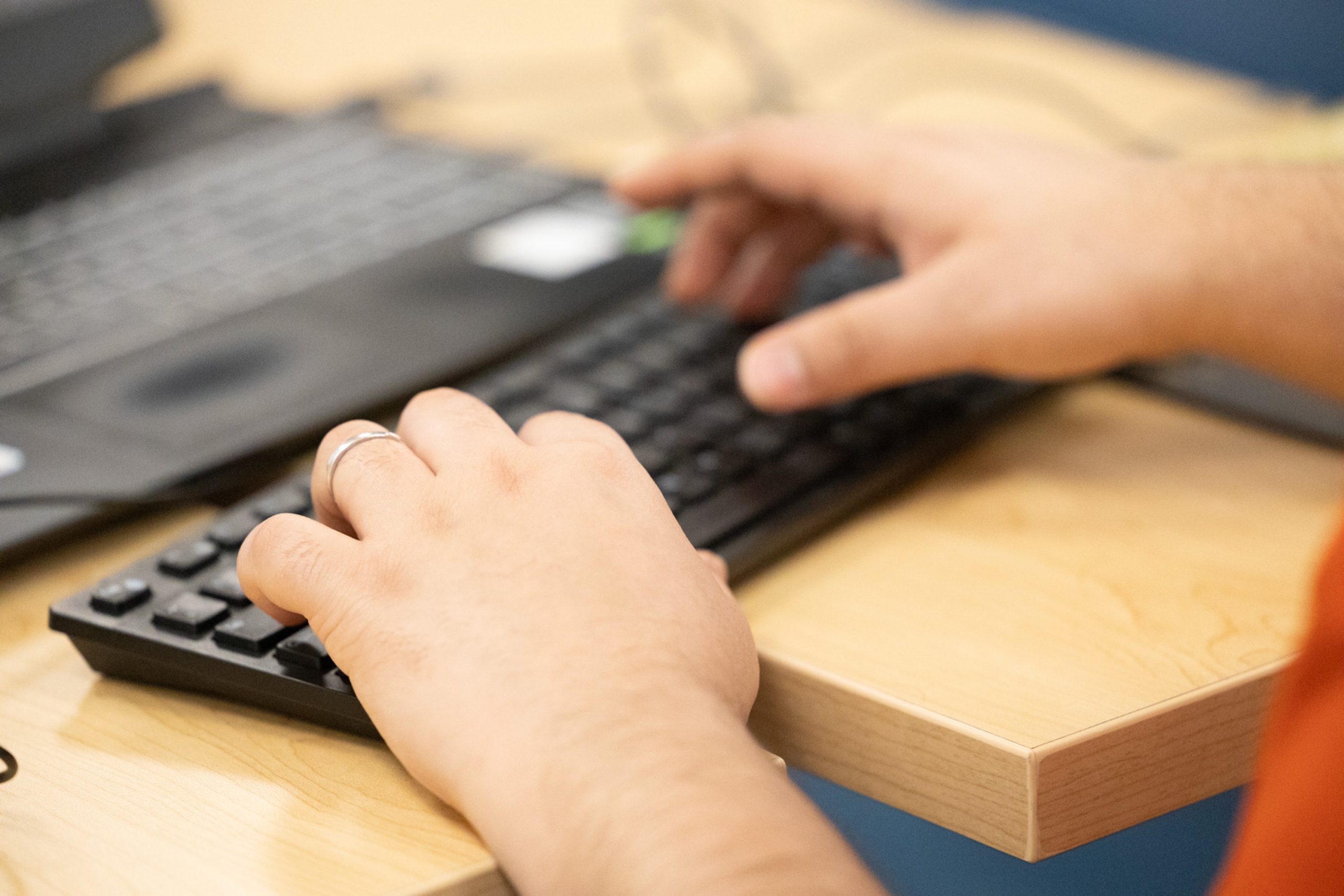 key board and grad students hands typing at grad writing retreat