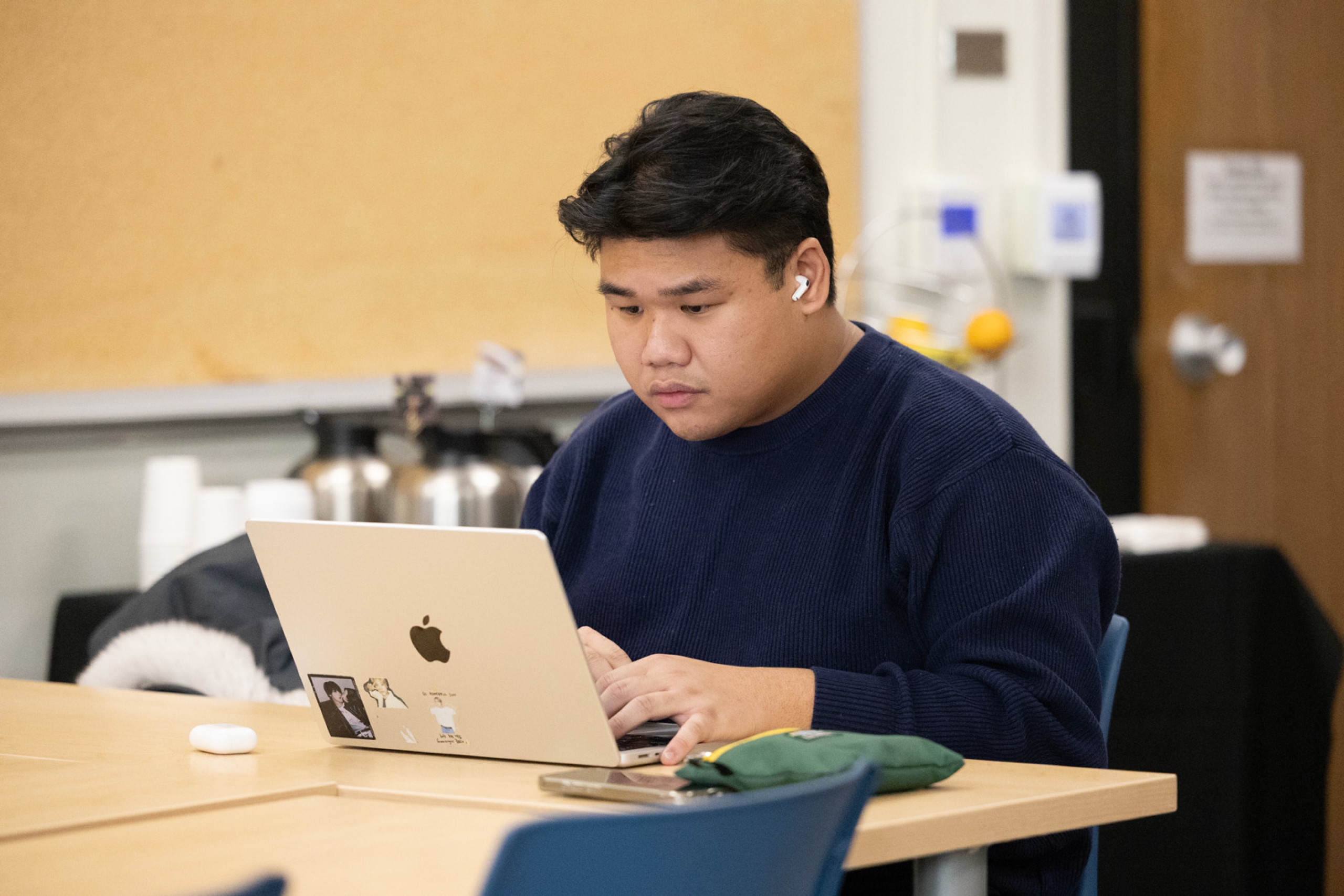 A grad student works on their thesis at the grad writing retreat