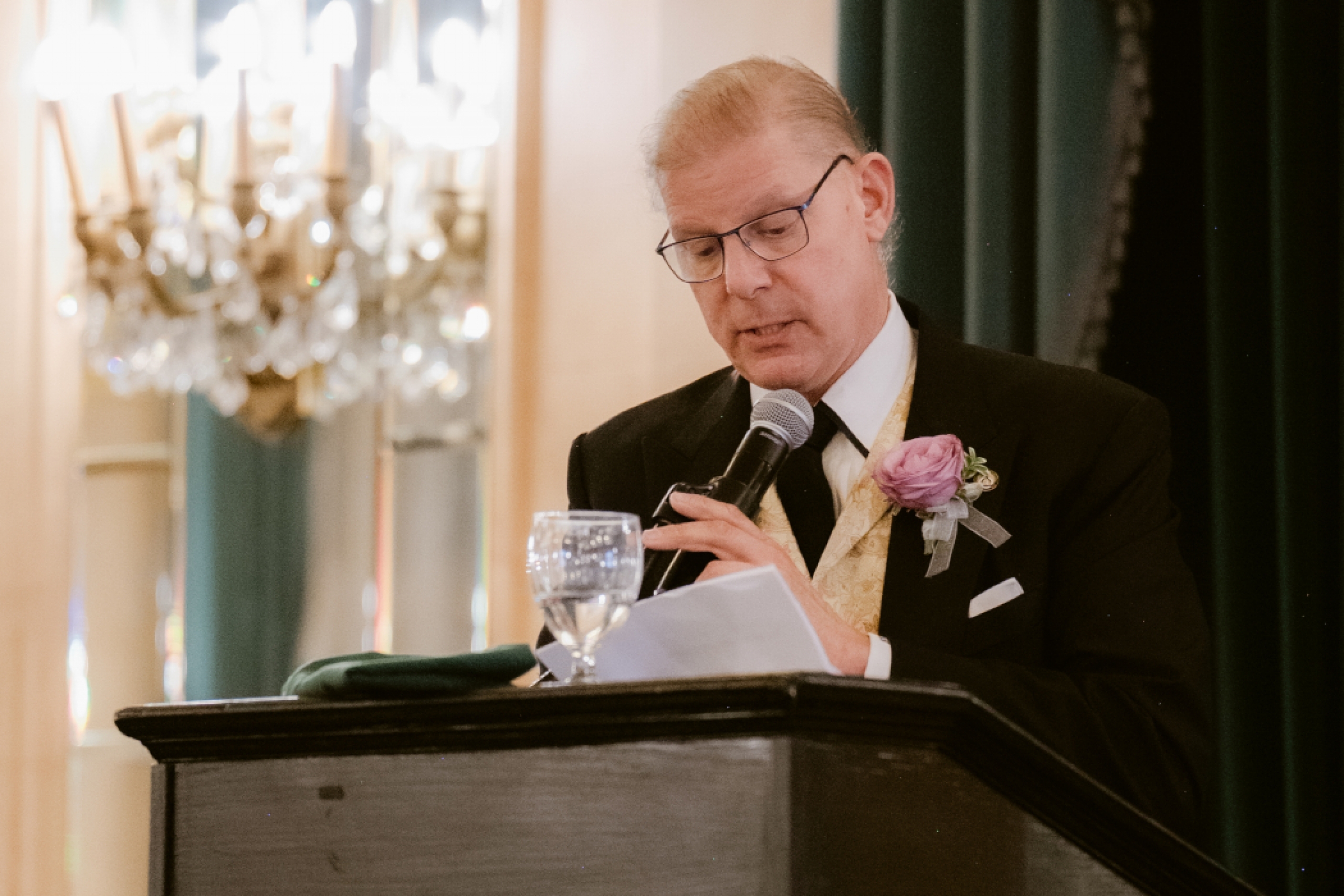 Dr. Chris Cottick speaks at a lectern. 