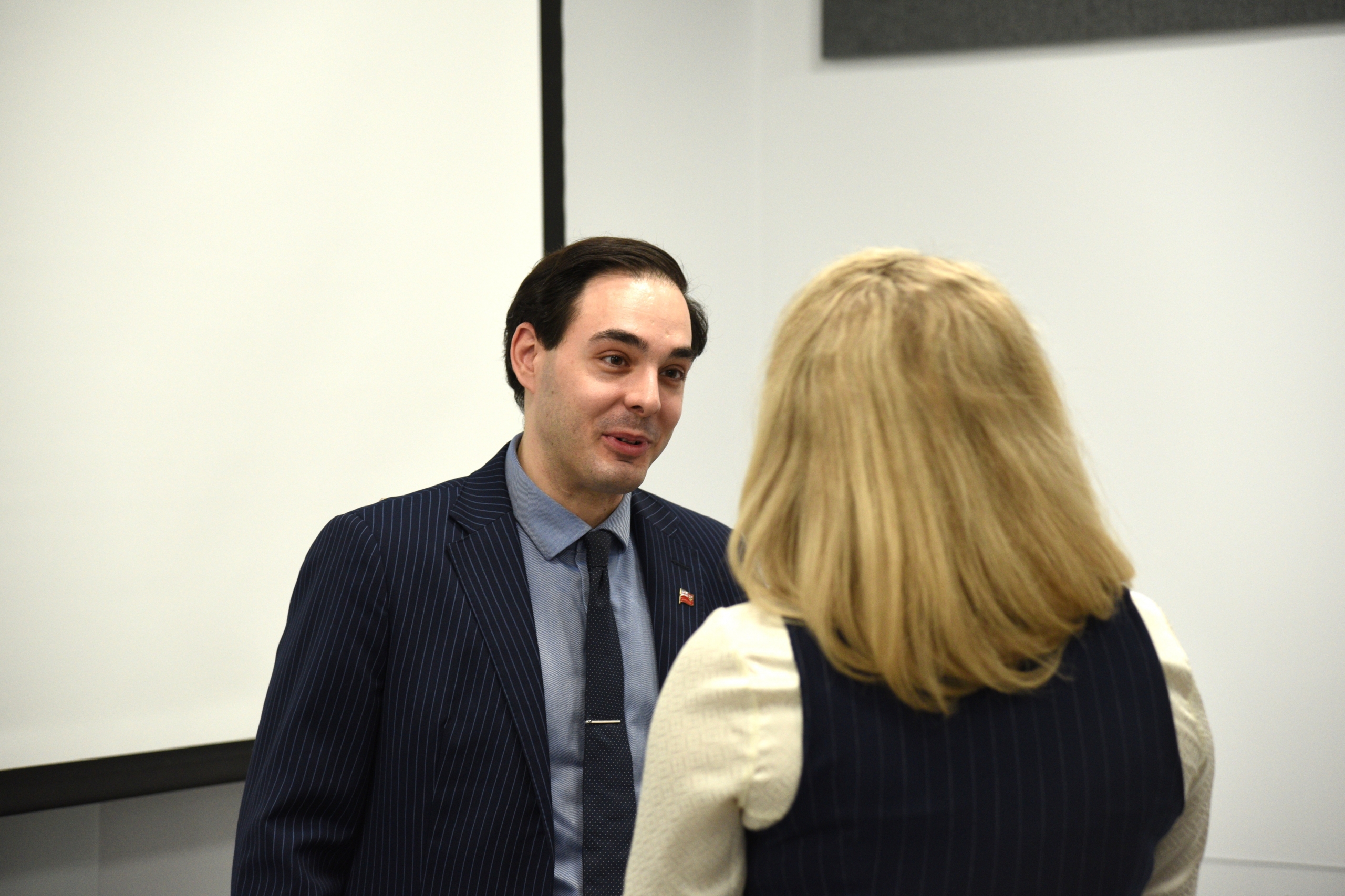 Paris Fragkoulis speaks with a student