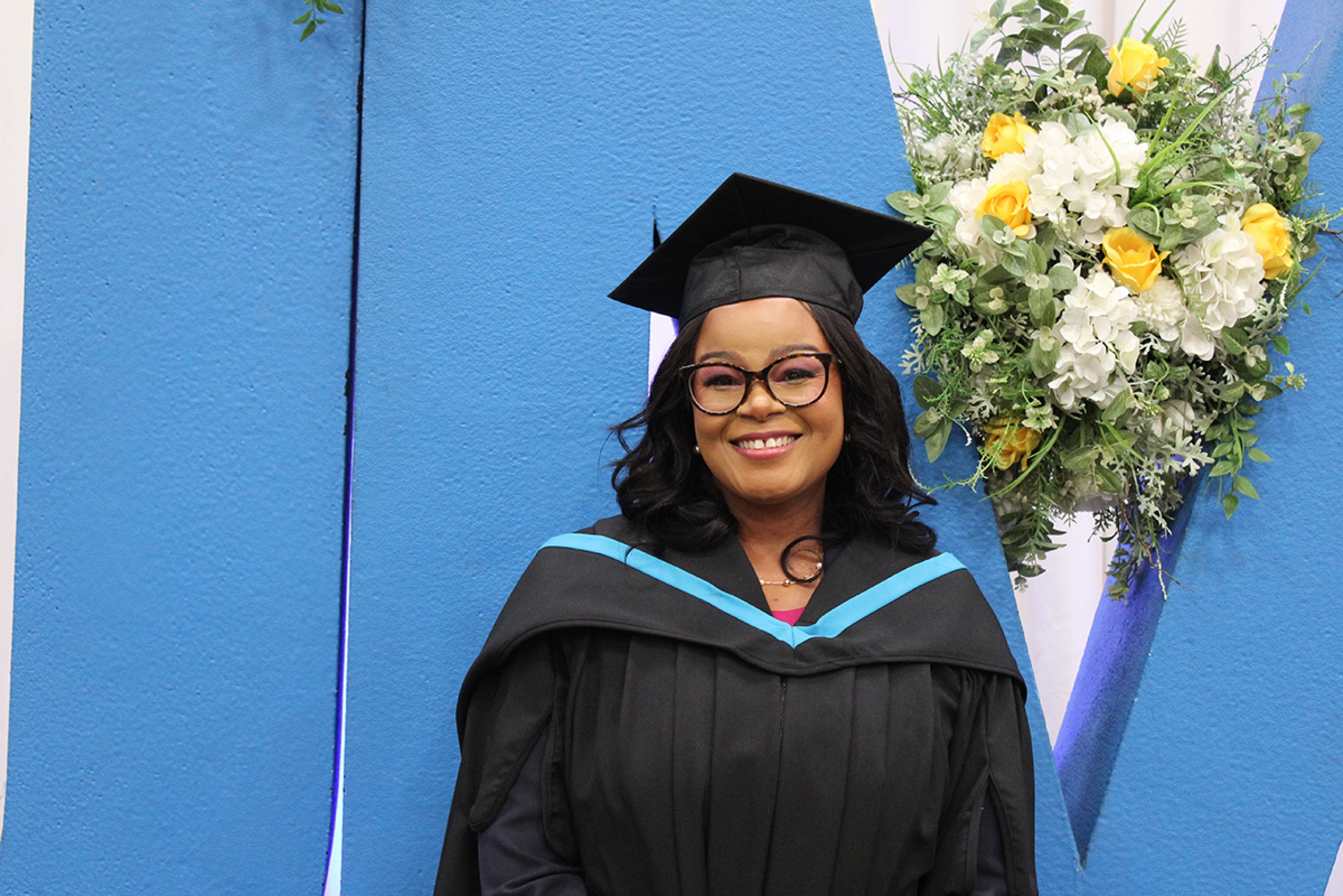 Abigail Kawadza in her cap and gown at convocation.