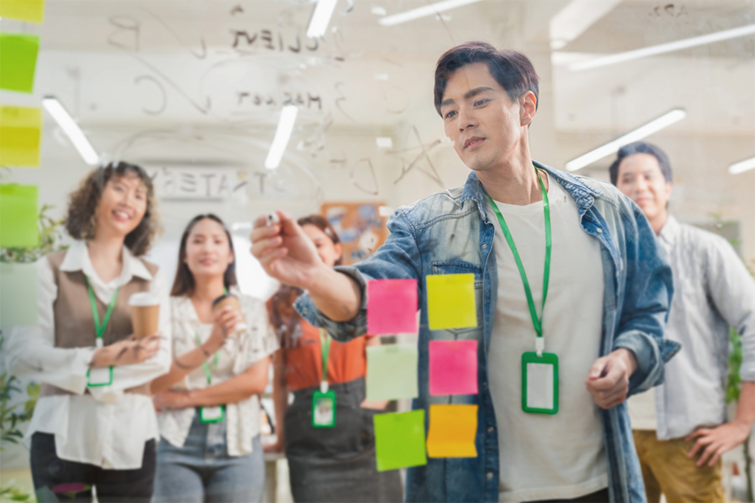Students collaborate with sticky notes
