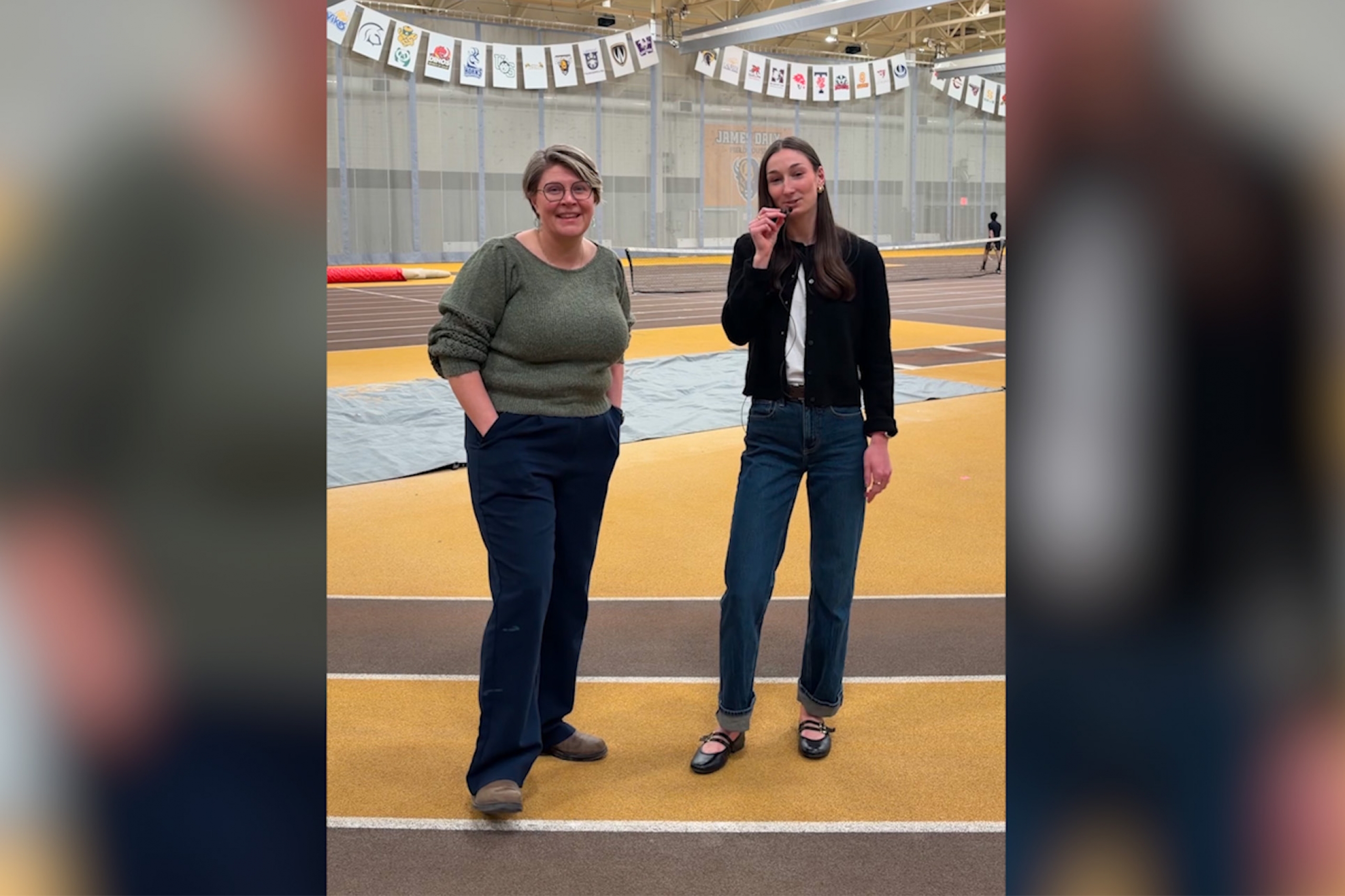 Dr. Mandi Baker and Kendall Mariott standing on the track during an interview
