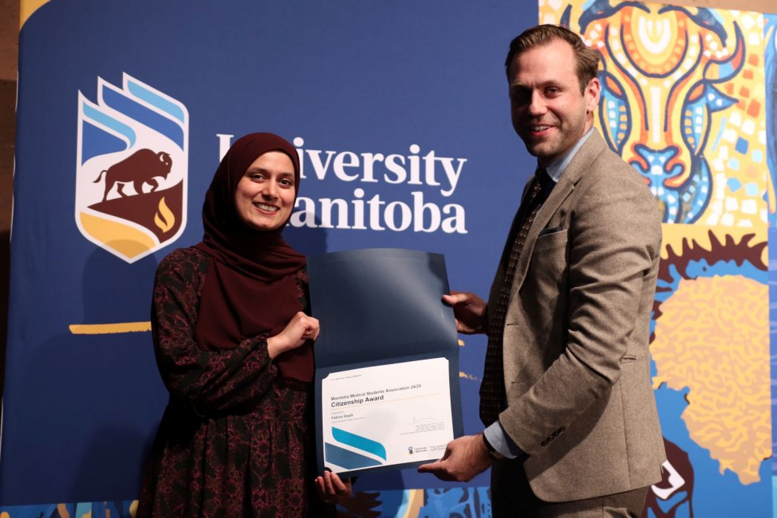 Person presents certificate to another person. 