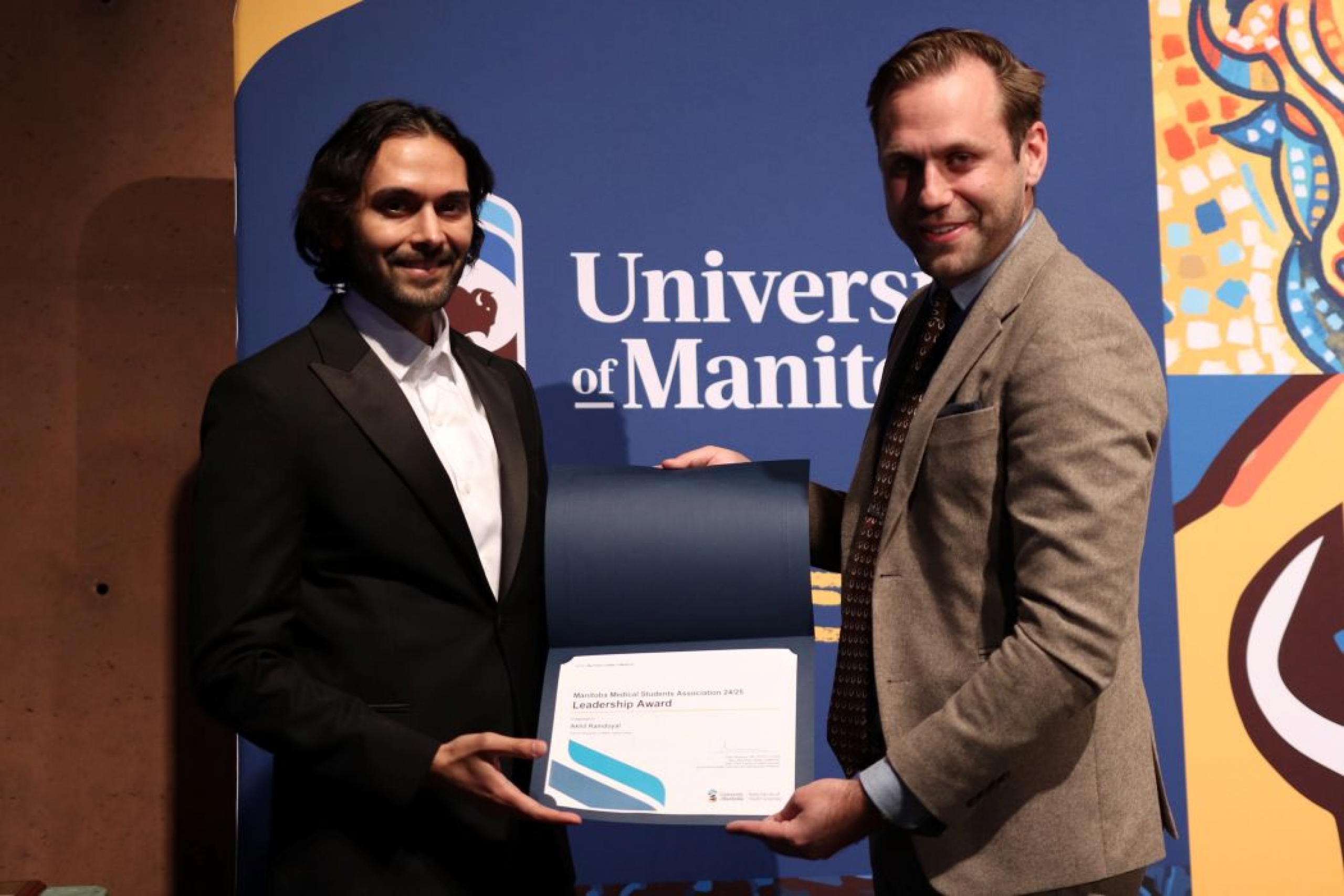 Person presents certificate to another person. 