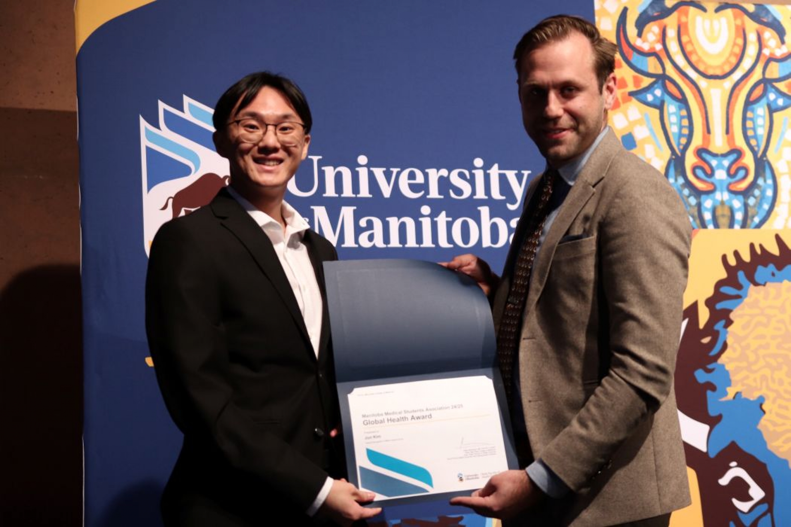 Person presents certificate to another person. 