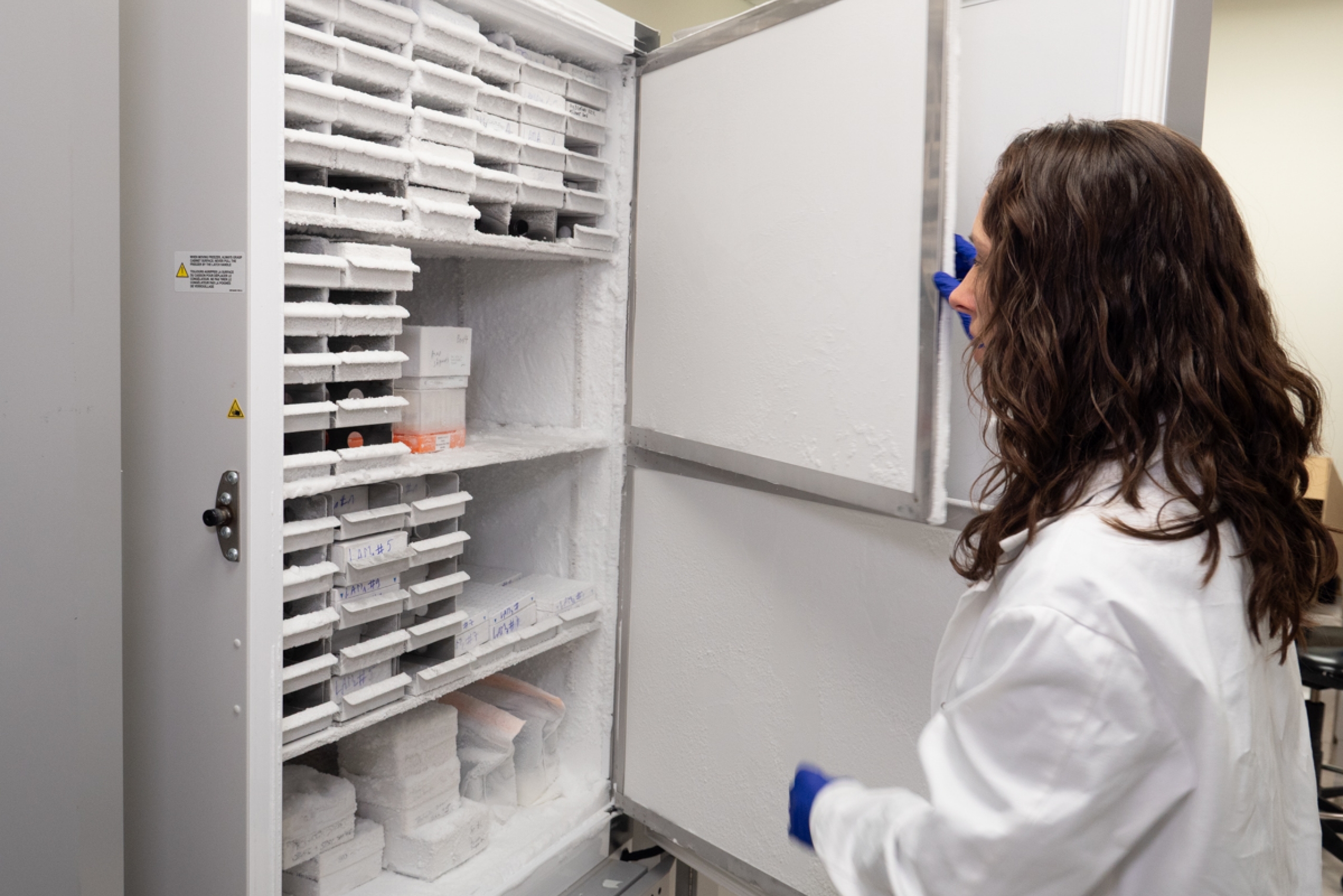Dr. Azad opens a biorepository freezer.