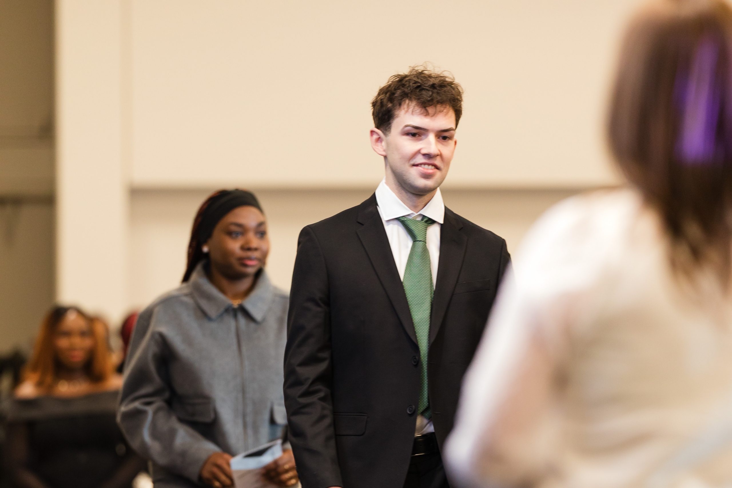 Kale Berger walks up to accept his nursing pin.