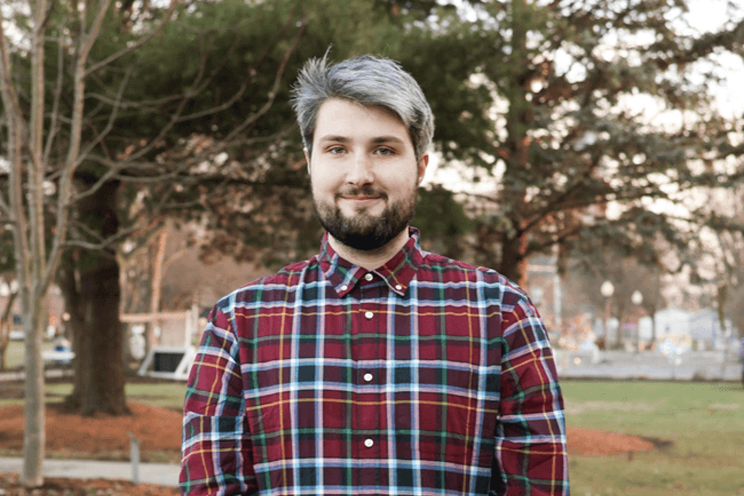 A person posing outside